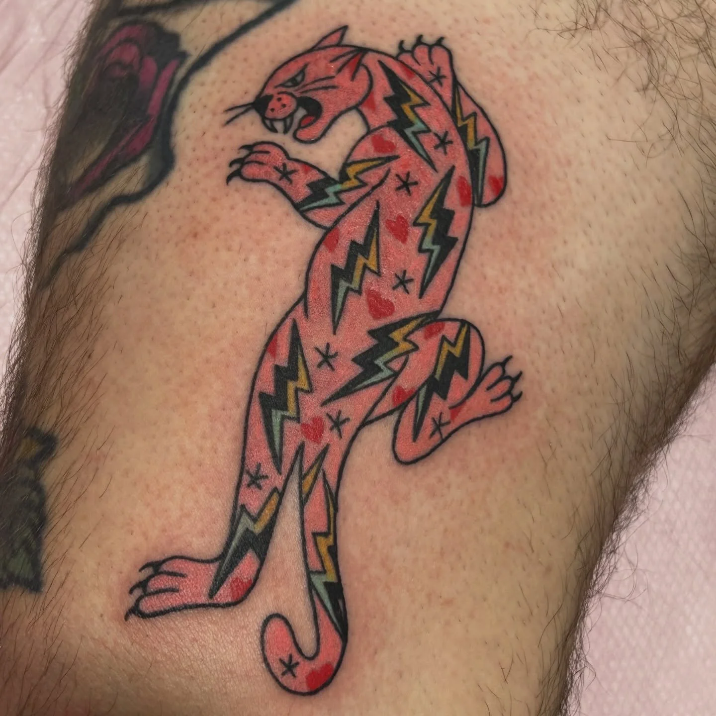 My first tattoo at the new shop AND first tattoo of 2026 just so happens to be my Electric Panther flash?!?! (With some added hearts because they&rsquo;re on someone I love) Wowie, I am just one very lucky girl 🥹

Big thanks to the most generally al