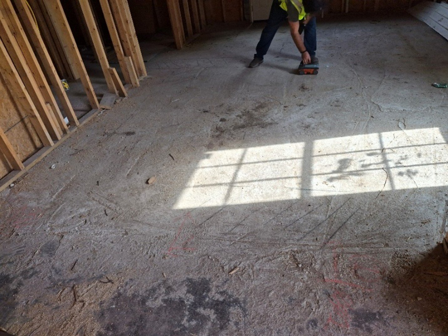 OmniVueNDT technician conducting 3D GPR scan using systematic grid pattern on concrete floor