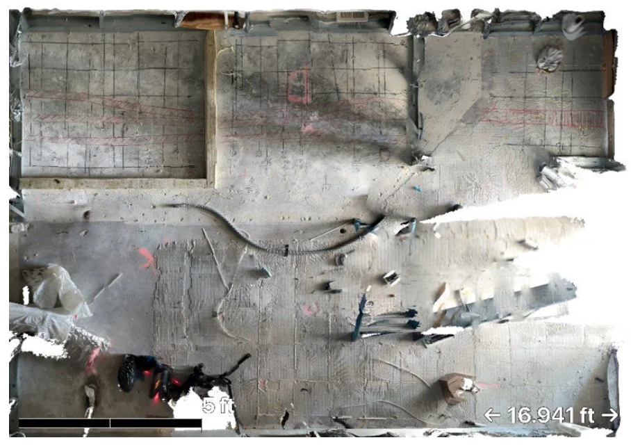 Aerial view of post-tension concrete slab showing GPR scan grid and surface markings identifying post-tension cables and reinforcing steel locations.