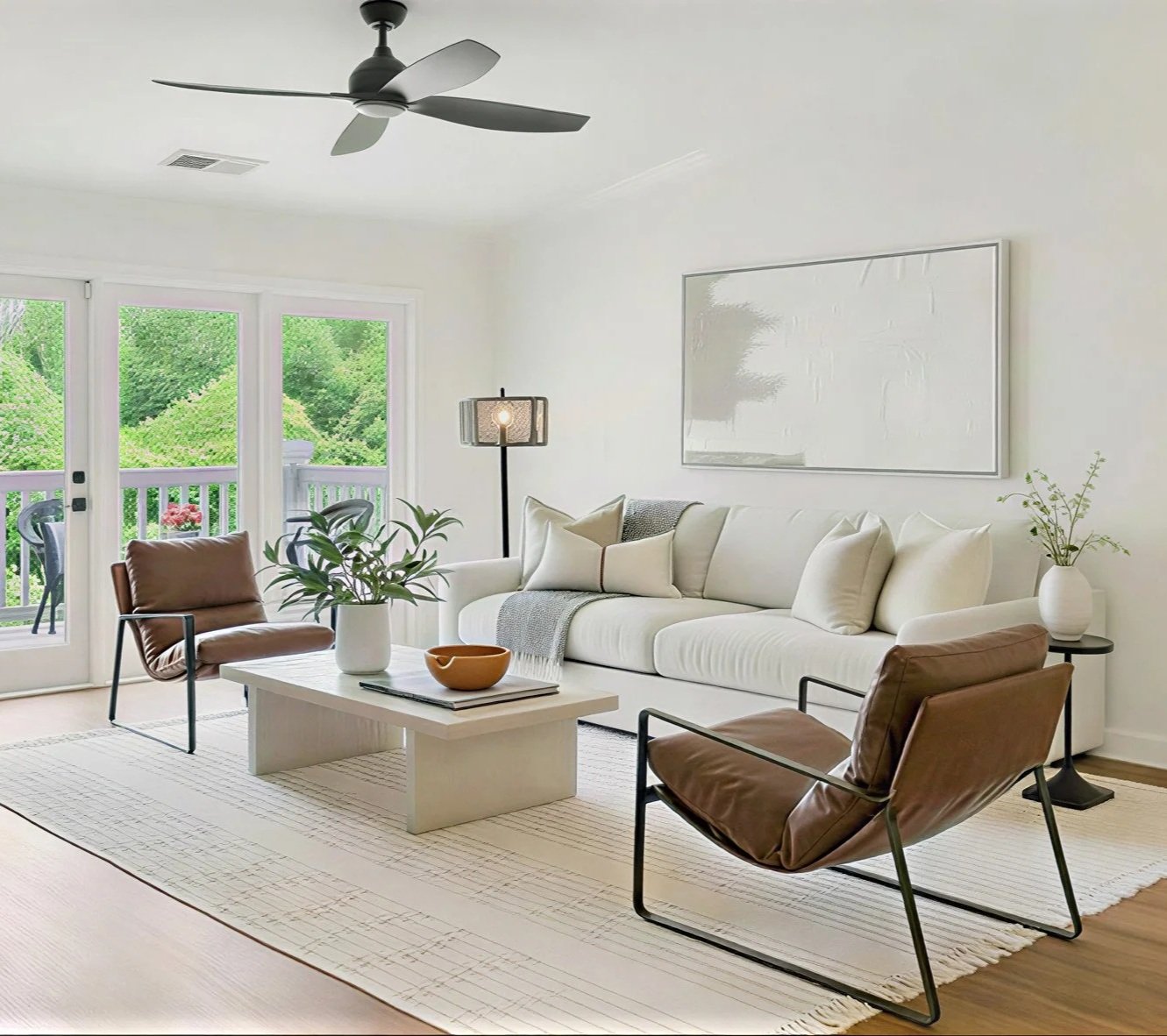 neutral living room home staging featuring soft textiles, curated decor, and a calming color palette