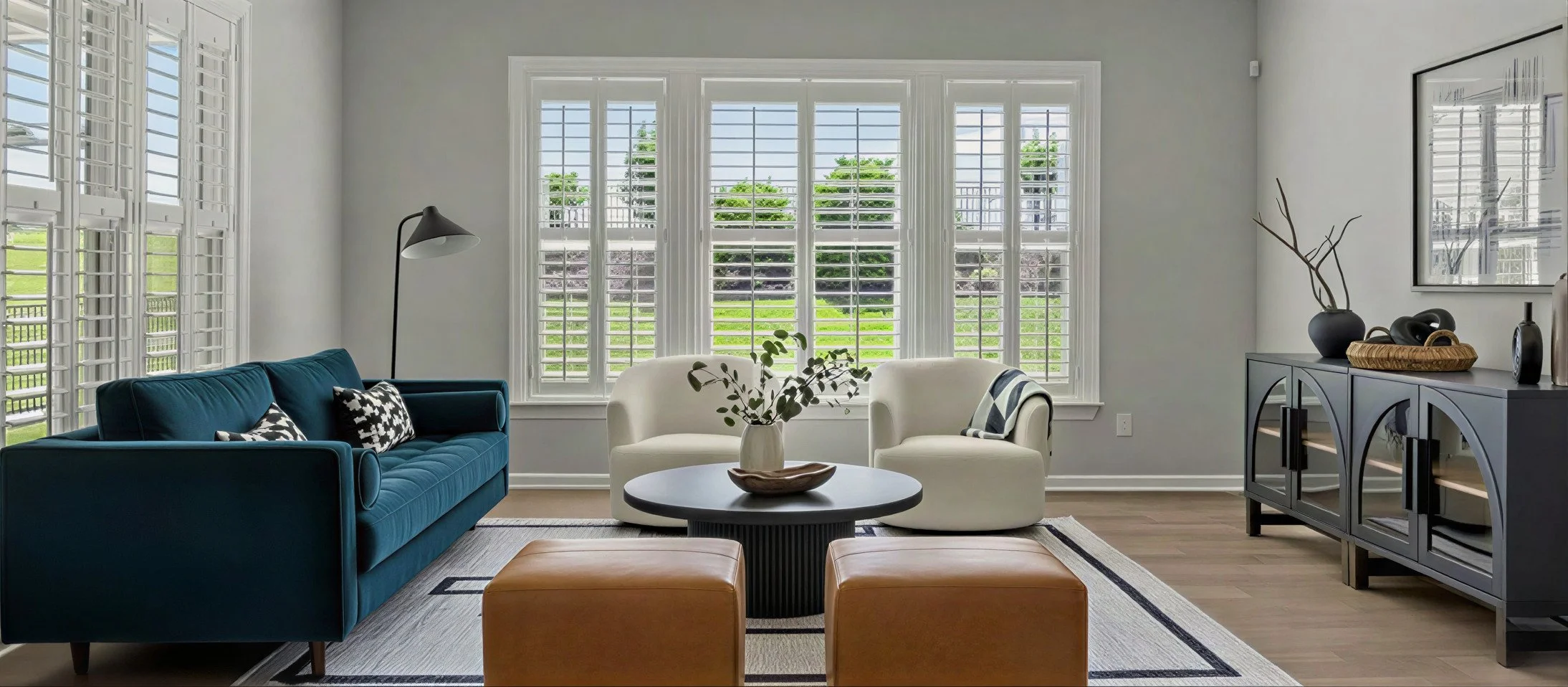 Cozy neutral living room with layered textures, warm wood accents, and modern organic furnishings