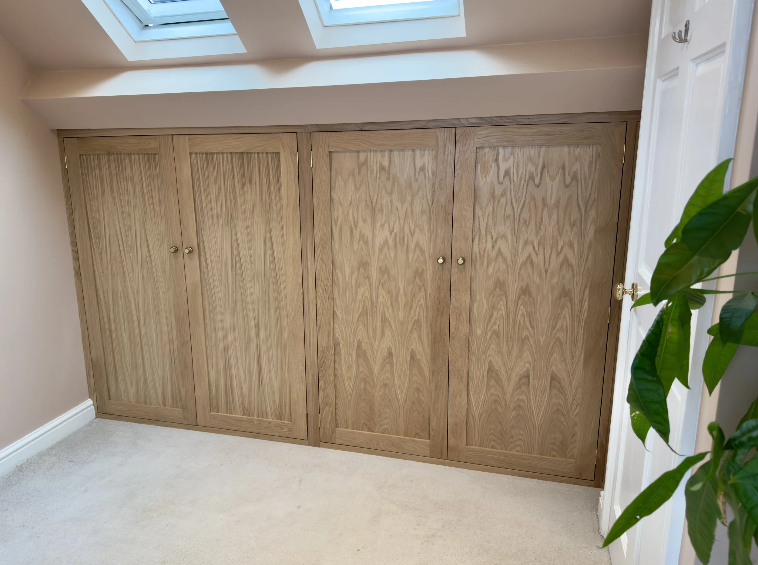 Bespoke oak wardrobe in loft bedroom. Bedroom storage.