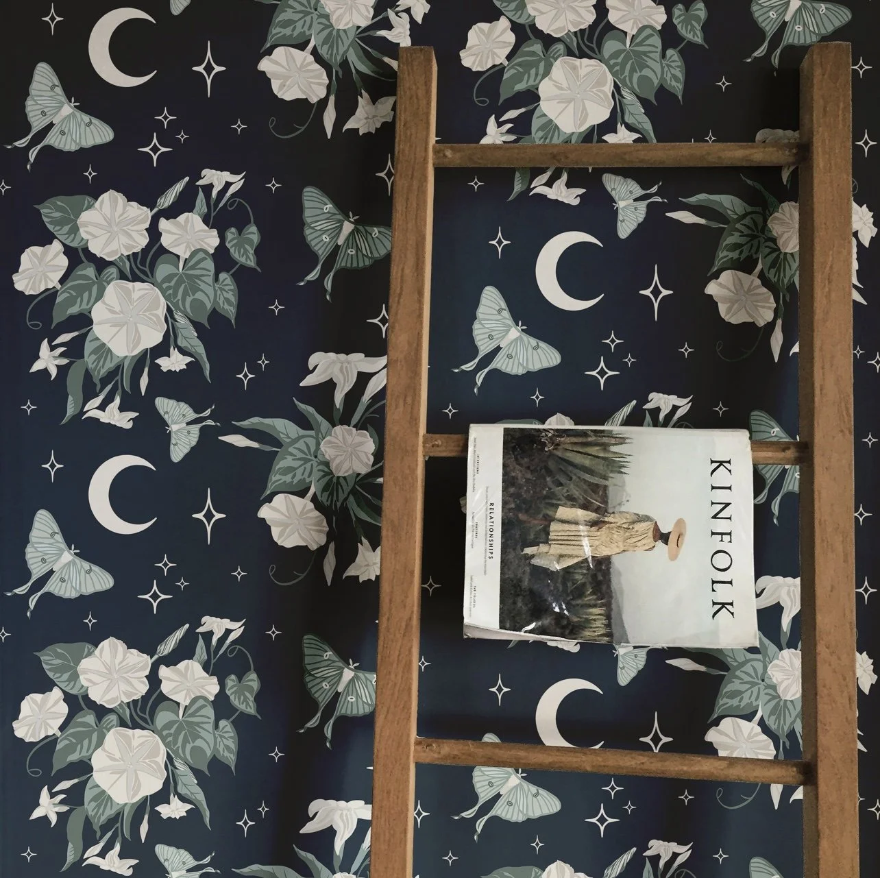 Add some magic to your space with luna moths and night blooming flowers wallpaper by sheena lange.