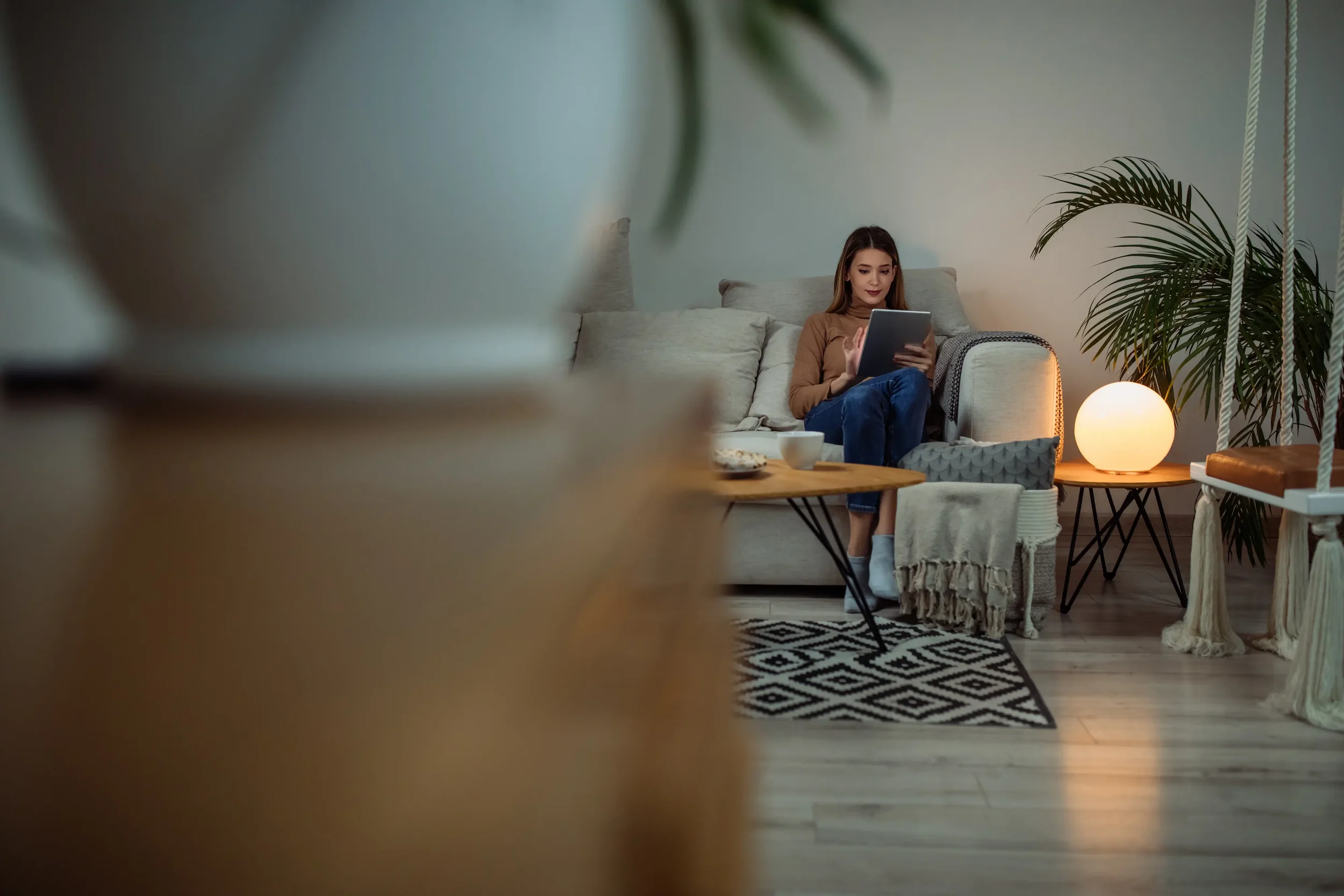 a woman on her IPad in her living room