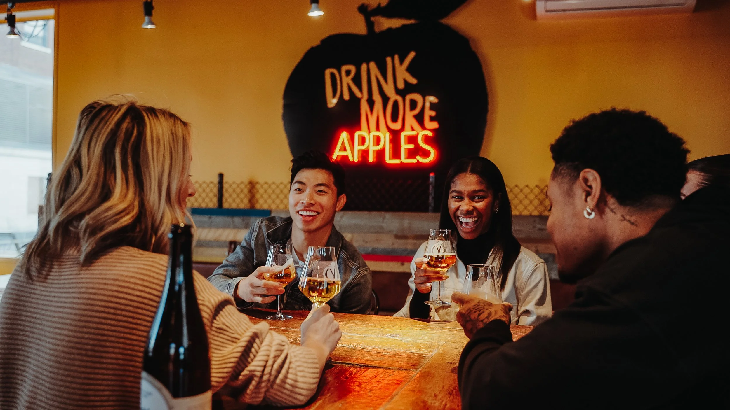 Friends enjoying cider at Chain Yard