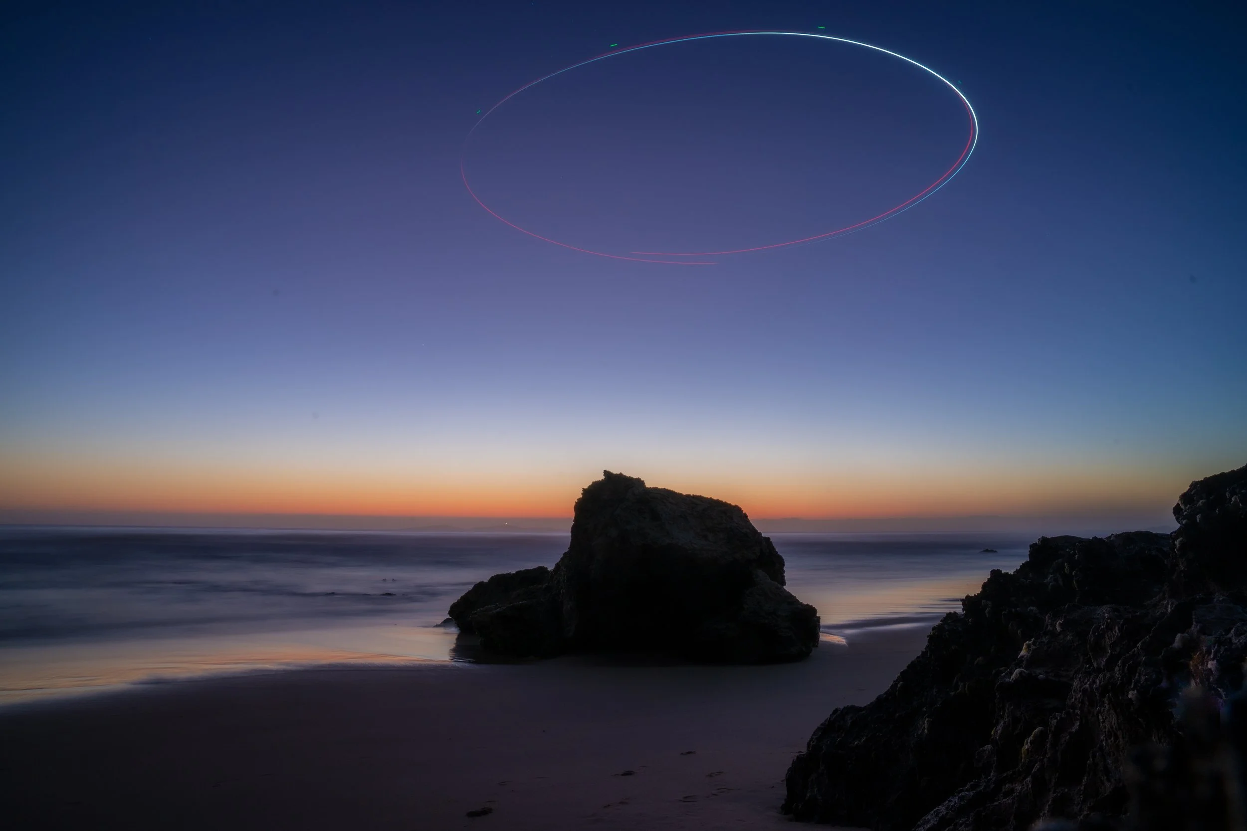 Narooma Beach Rock at Sunrise with a drone halo above it