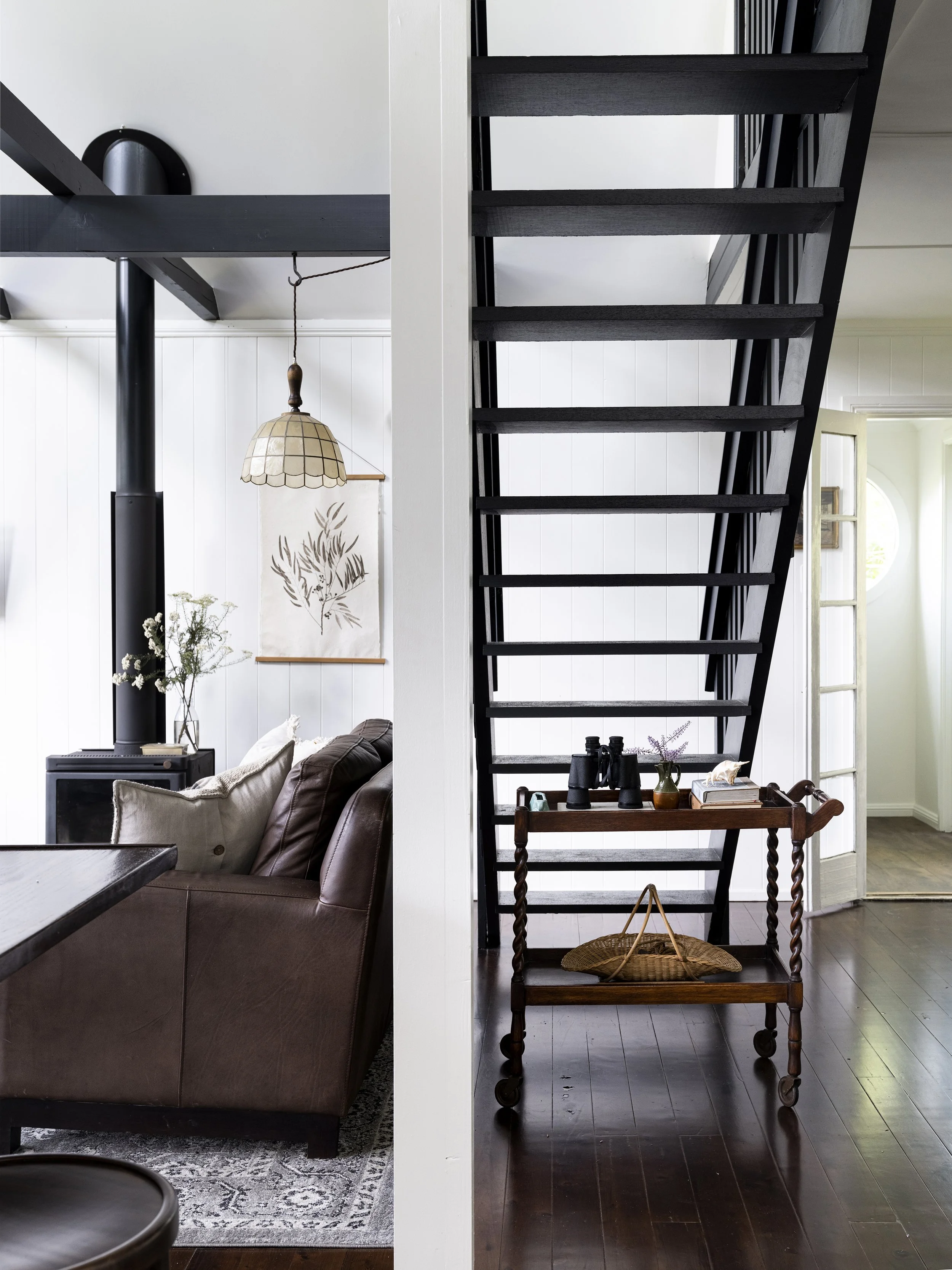 Cosy lounge space at Seals Way with leather seating and forest views