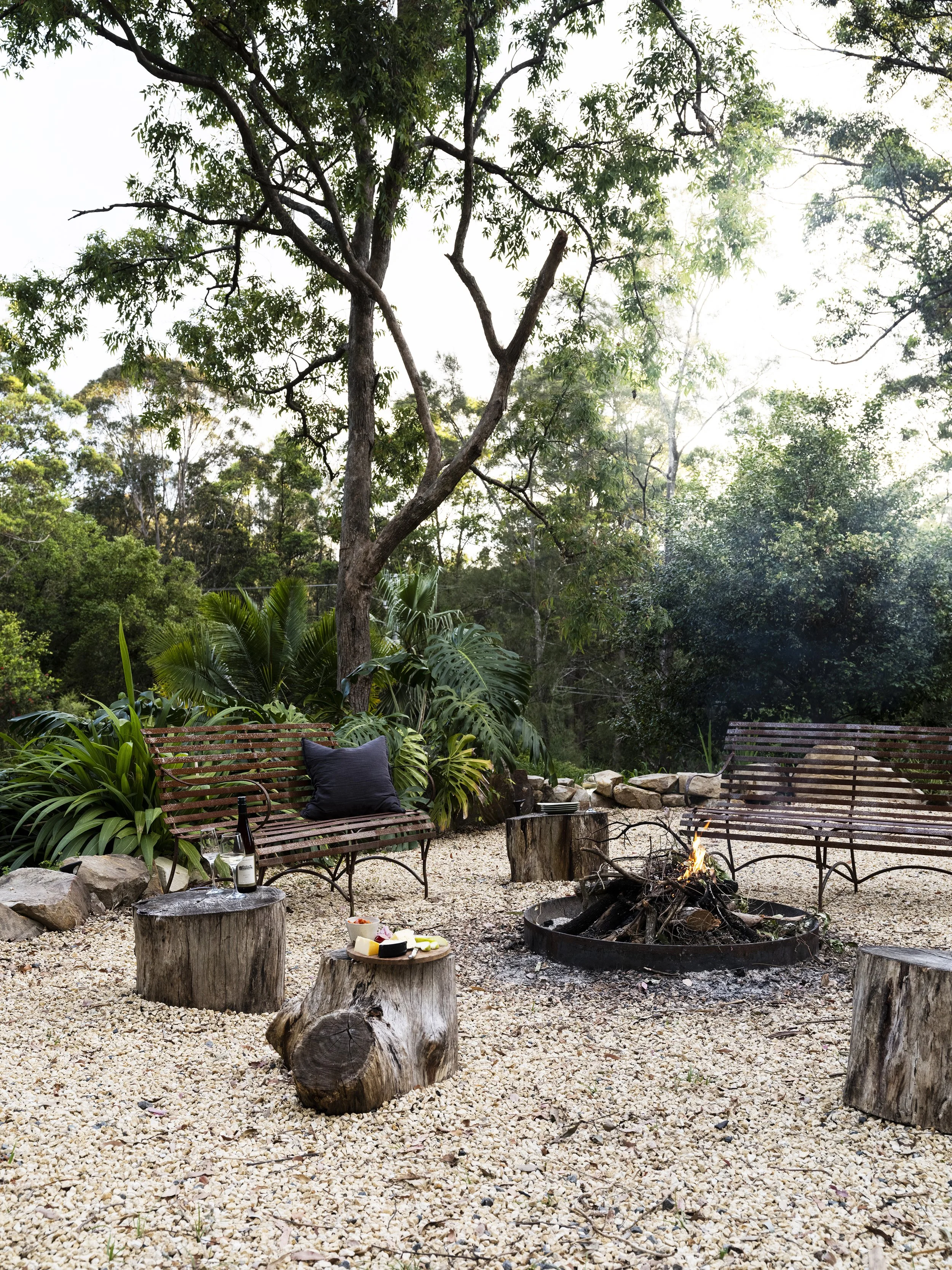 Seals Way outdoor fire pit and gathering space among the trees