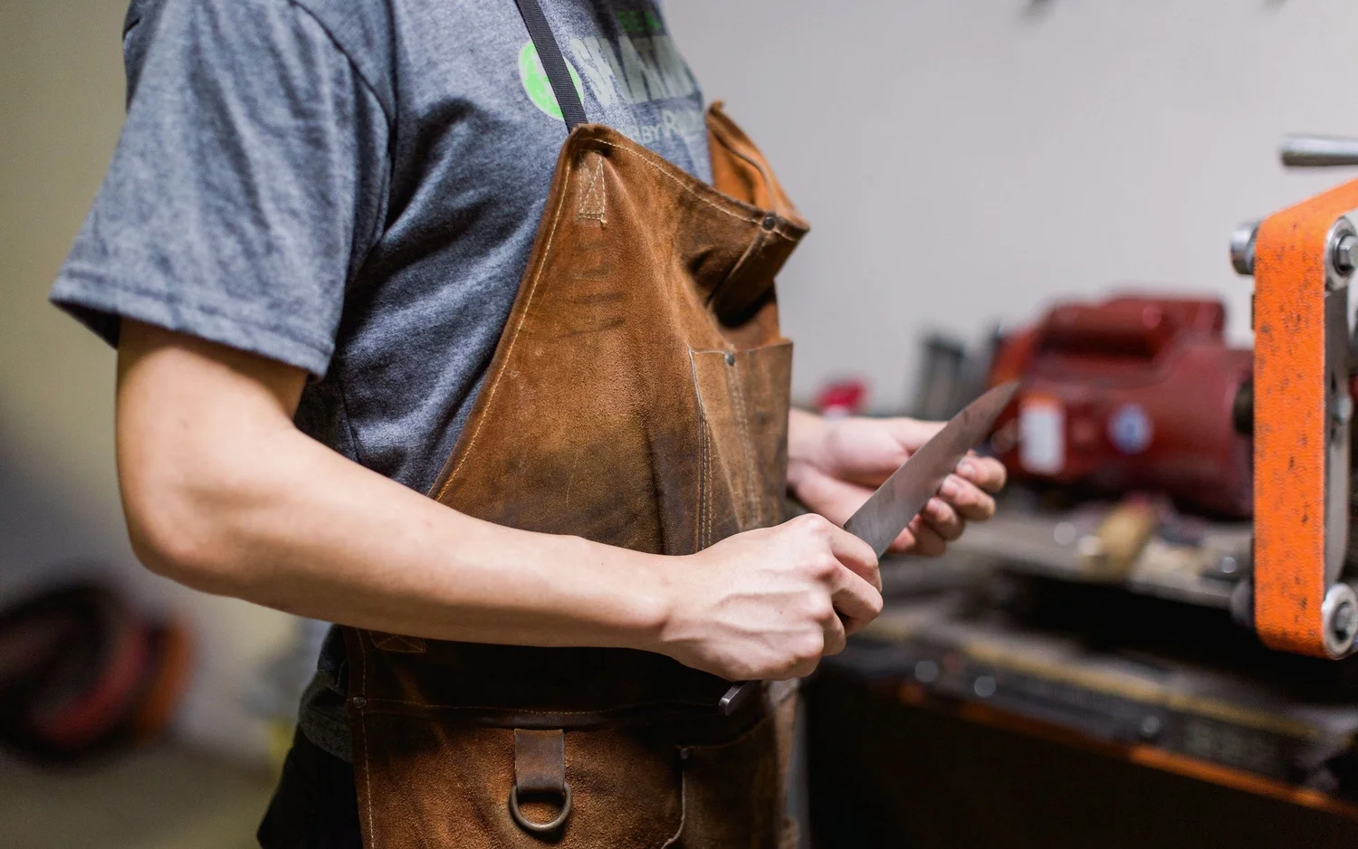 Jesse Hu holding a handcrafted knife