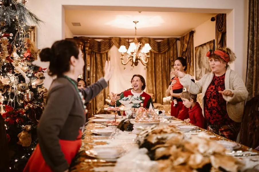 family-singing-carols-at-christmas-eve-dinner