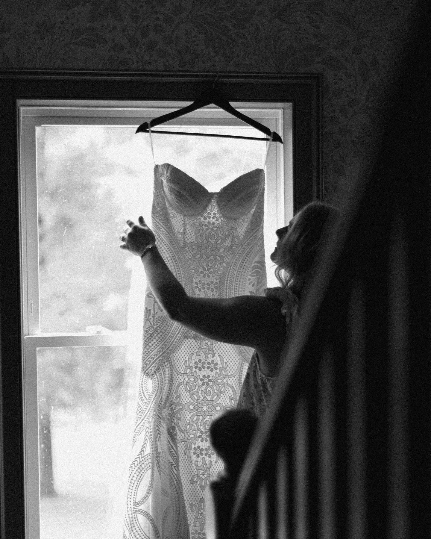 black + whites hold a special place in my heart. they simply encapsulate the moment so timelessly. 

1.) the bride admiring her gown
2.) the welcome sign
3.) brothers setting the flowers for the aisle
4.) the ladies making bouquets + putting the gown