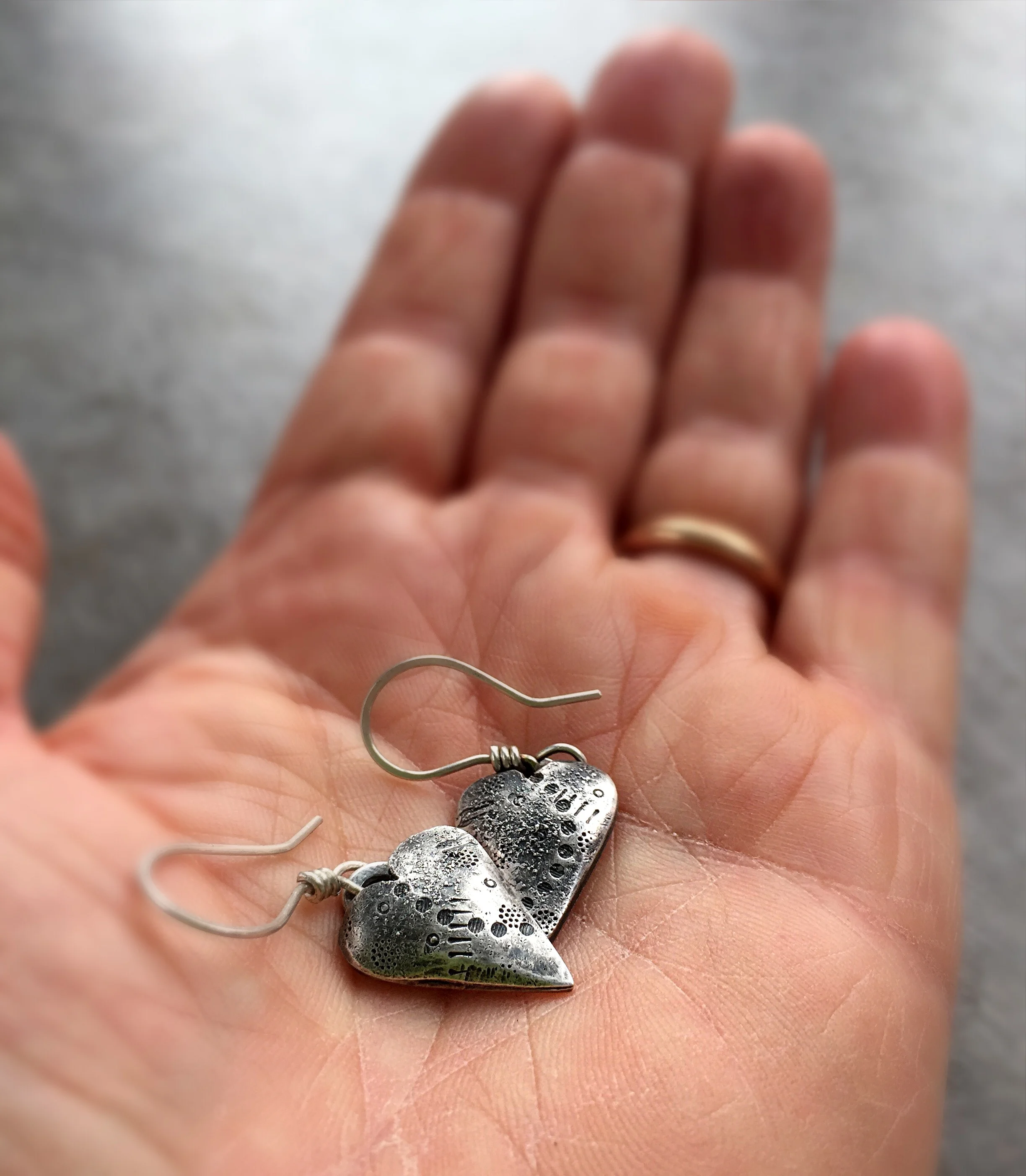  A pair of custom 'Follow Your Heart' earrings made from sterling silver hollow formed and textured for a rustic finish. &nbsp;Oxidised and polished to bring out the textures and sealed for protection. 
