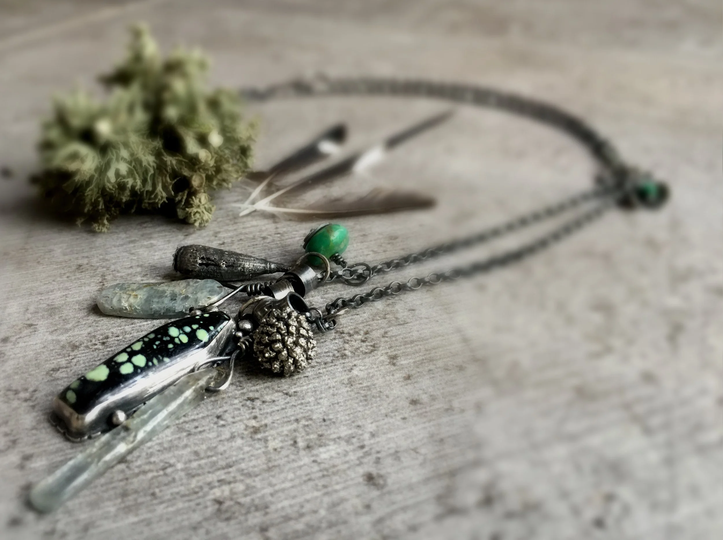  Inspired by the late summer when nature invests in its seeds and pods ready for new life in spring. Decked in a cabachon set New Lander turquoise and turquoise beads with sterling silver oxidised poppy pods and cornus fruits, all collected together 