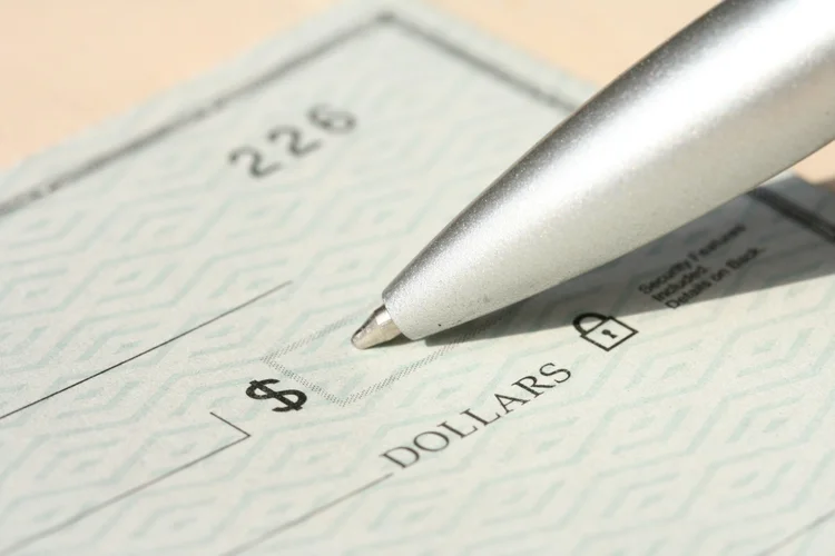 Close up of pen writing Check