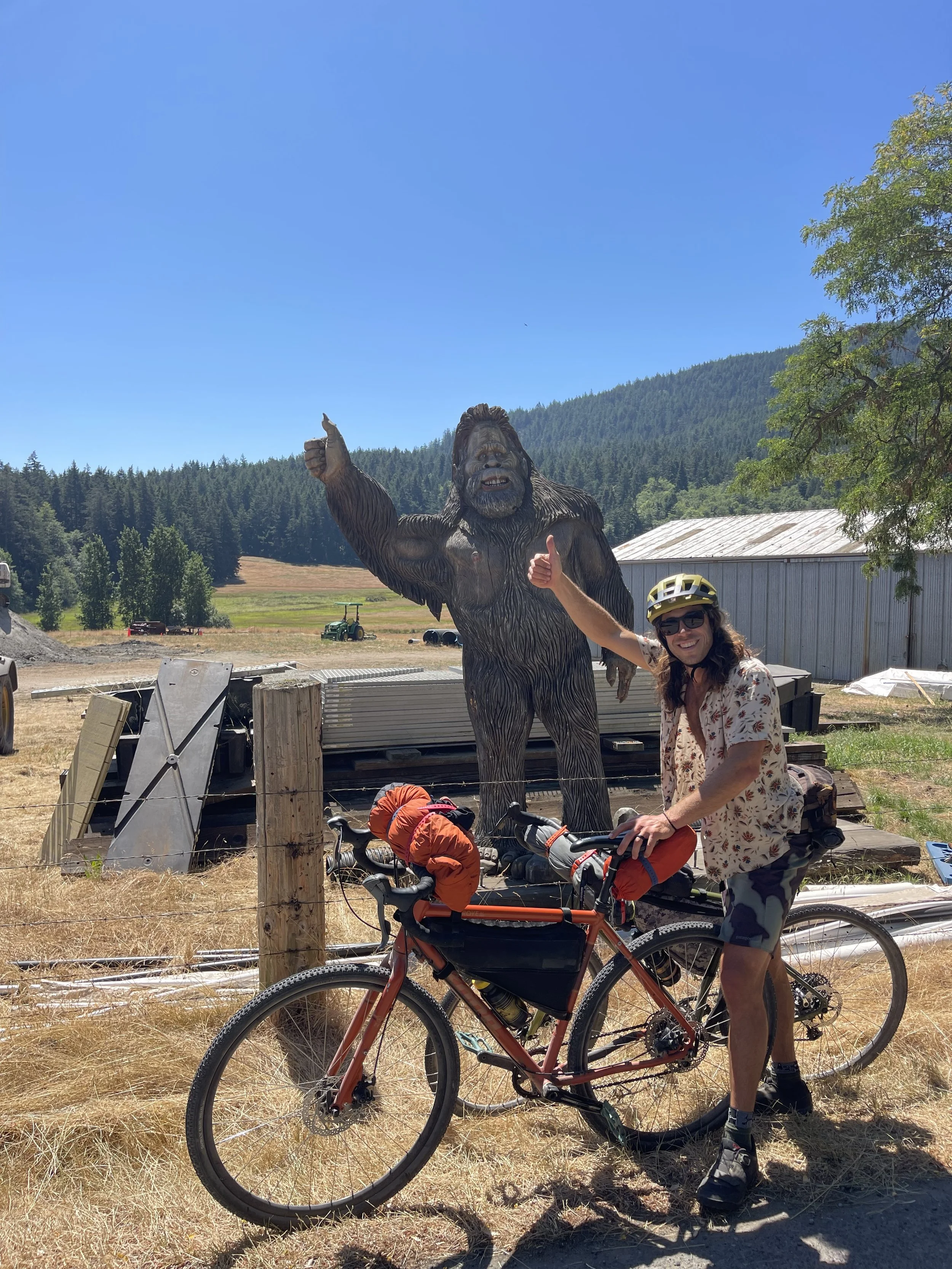 mountain biker with helmet and bigfoot