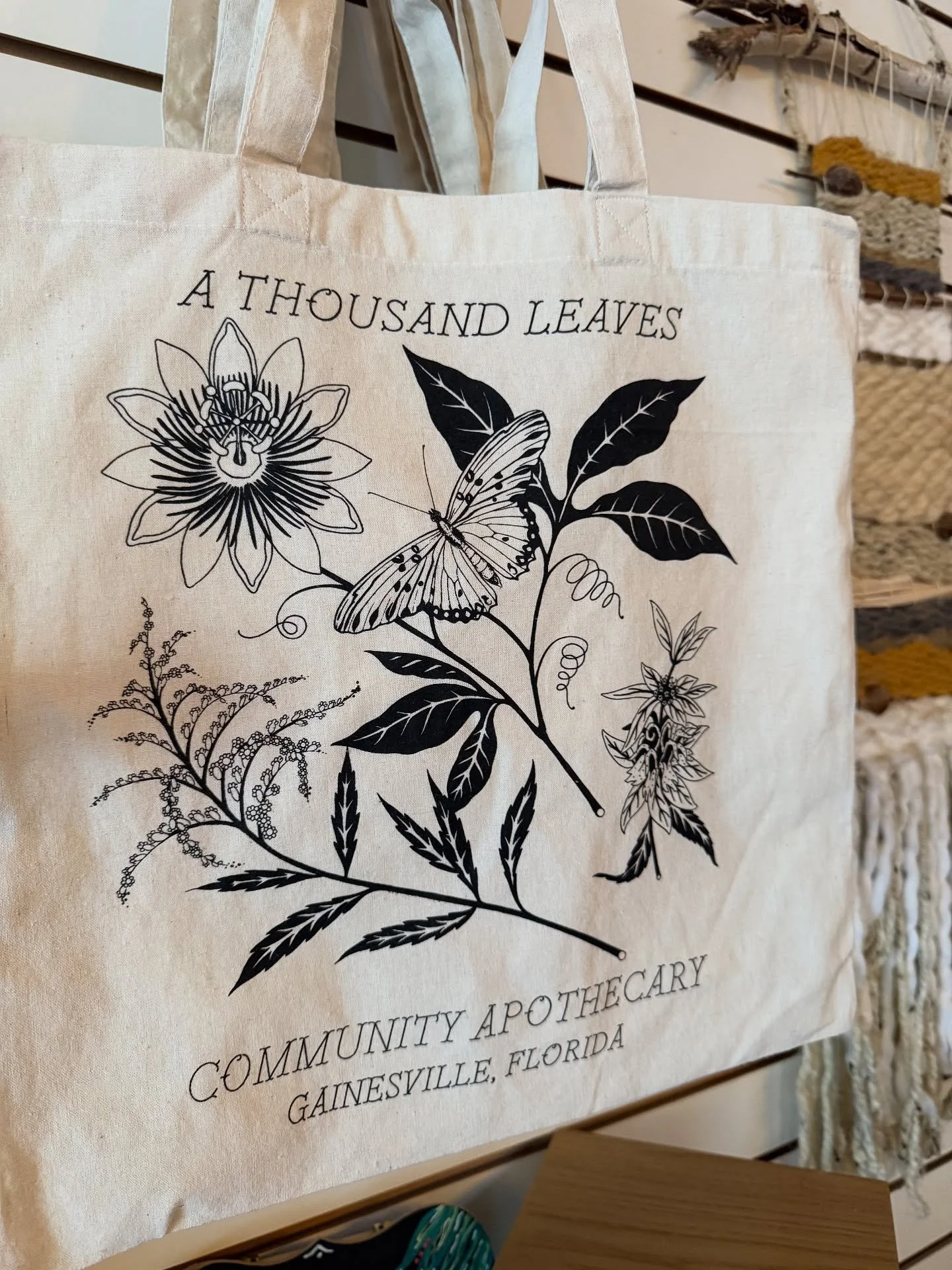 We got tote bags y’all! 
Featuring local native plants Goldenrod, Passionflower, and Bee Balm and a cutie Gulf Fritillary butterfly. 
Drawn by the one and only @nickhalltattoo, screen printed locally @aestheticprint