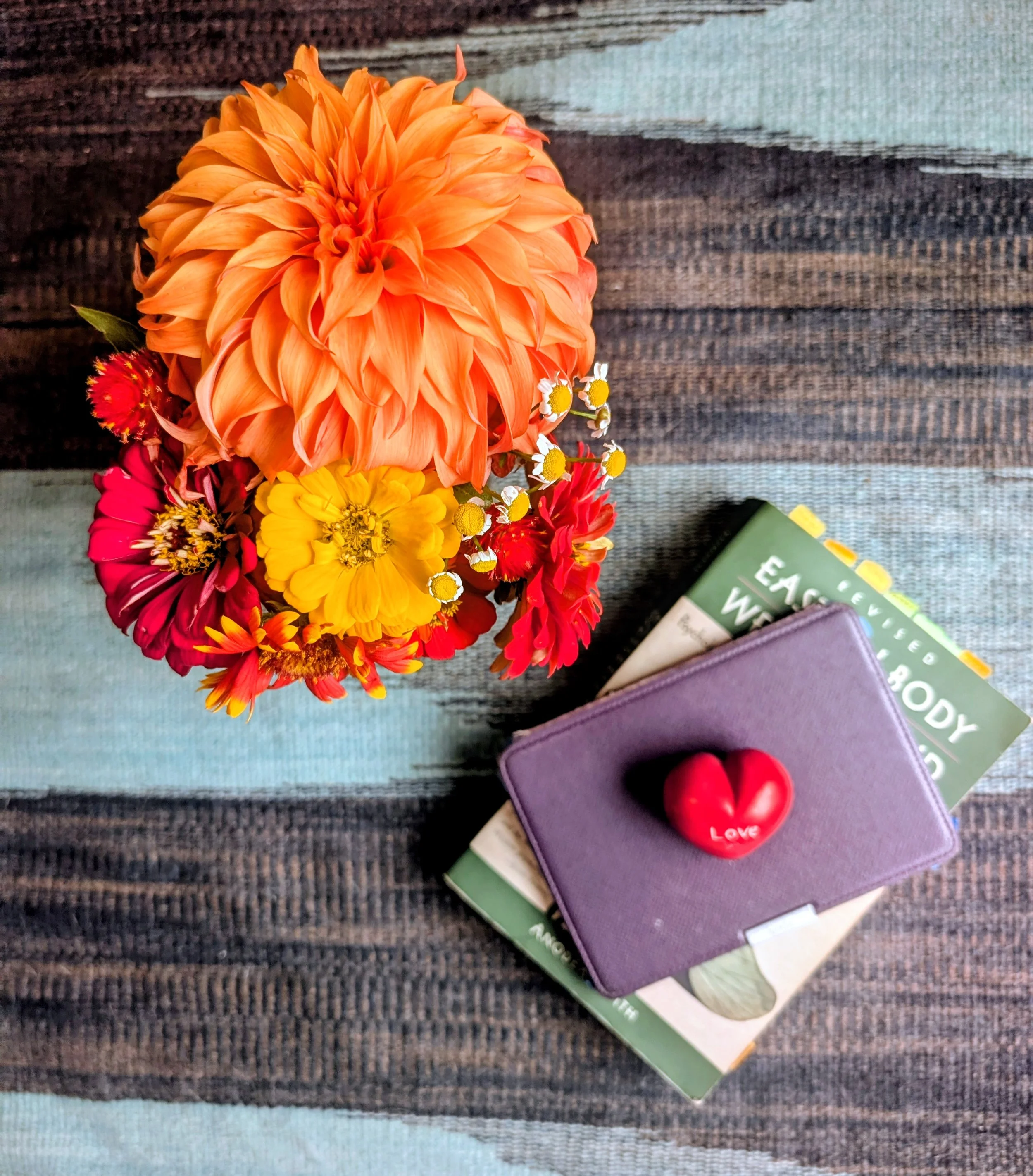 book flowers heart rock stack