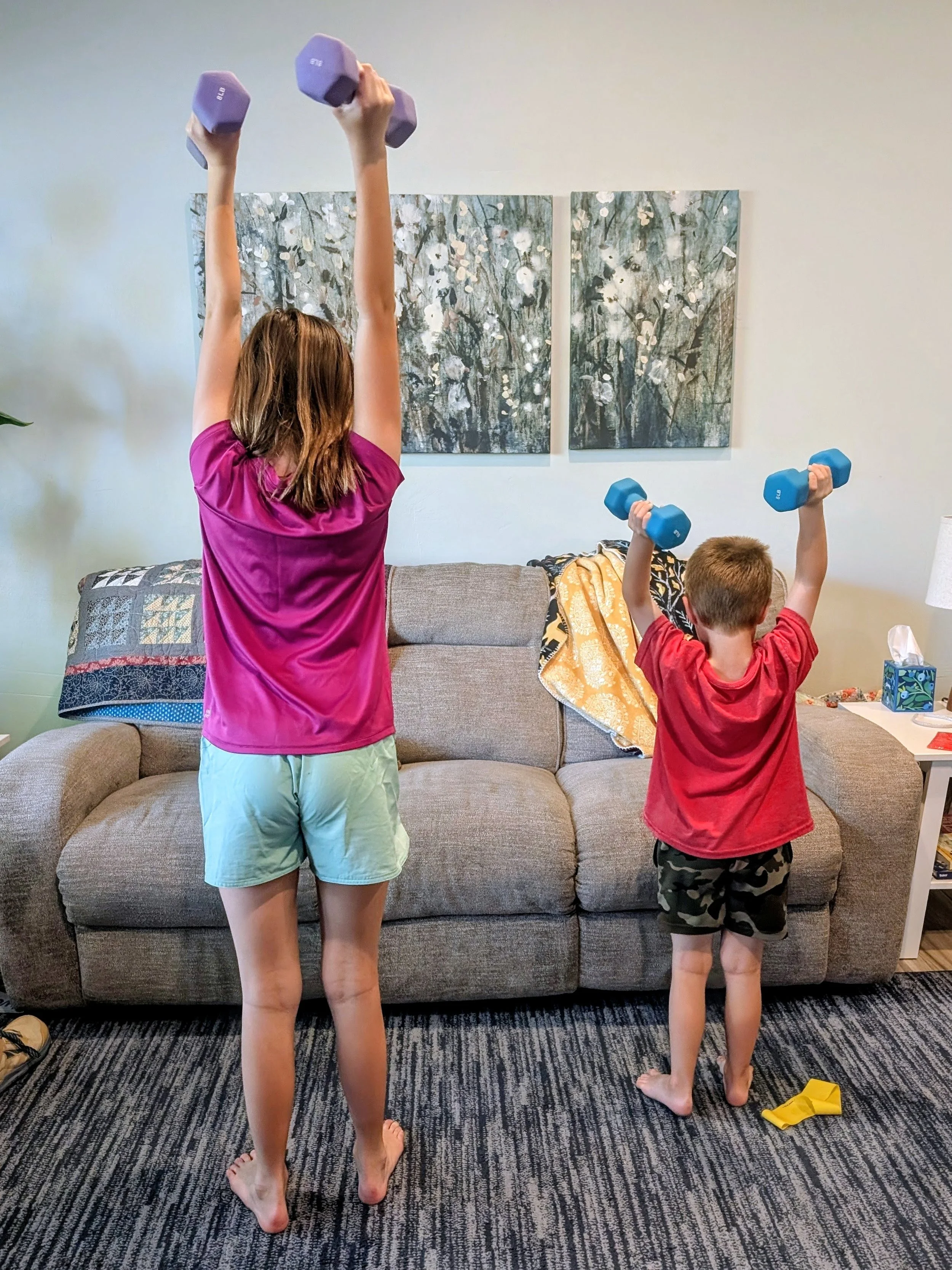 kids lifting weights