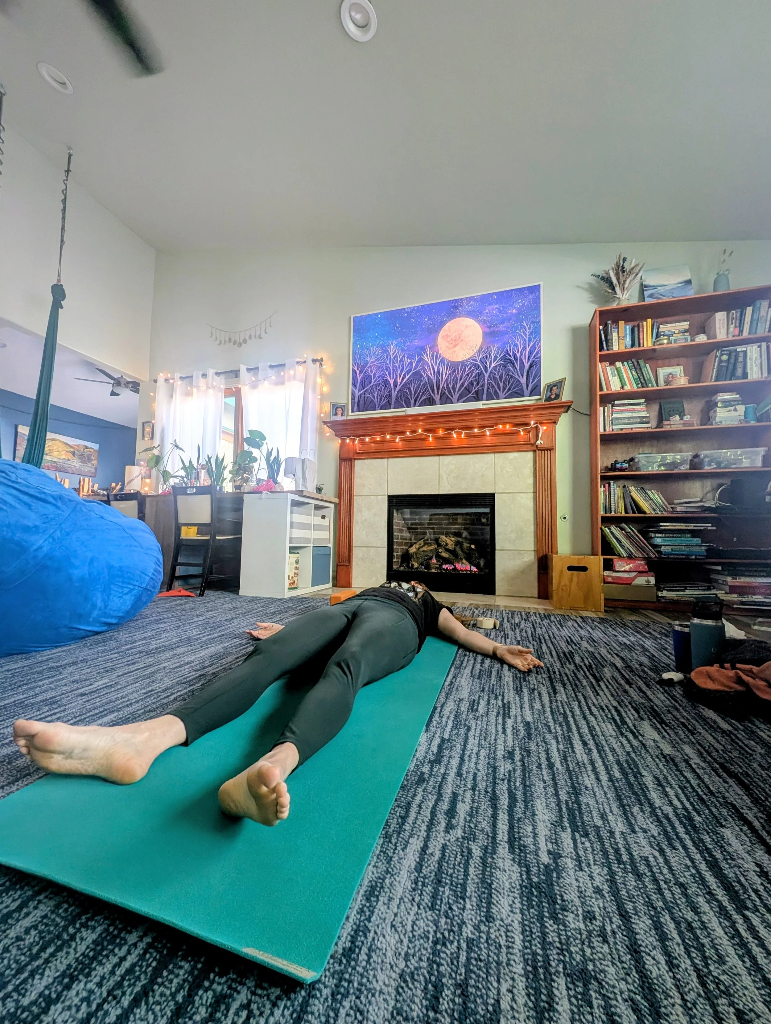 woman in relaxation pose in living room