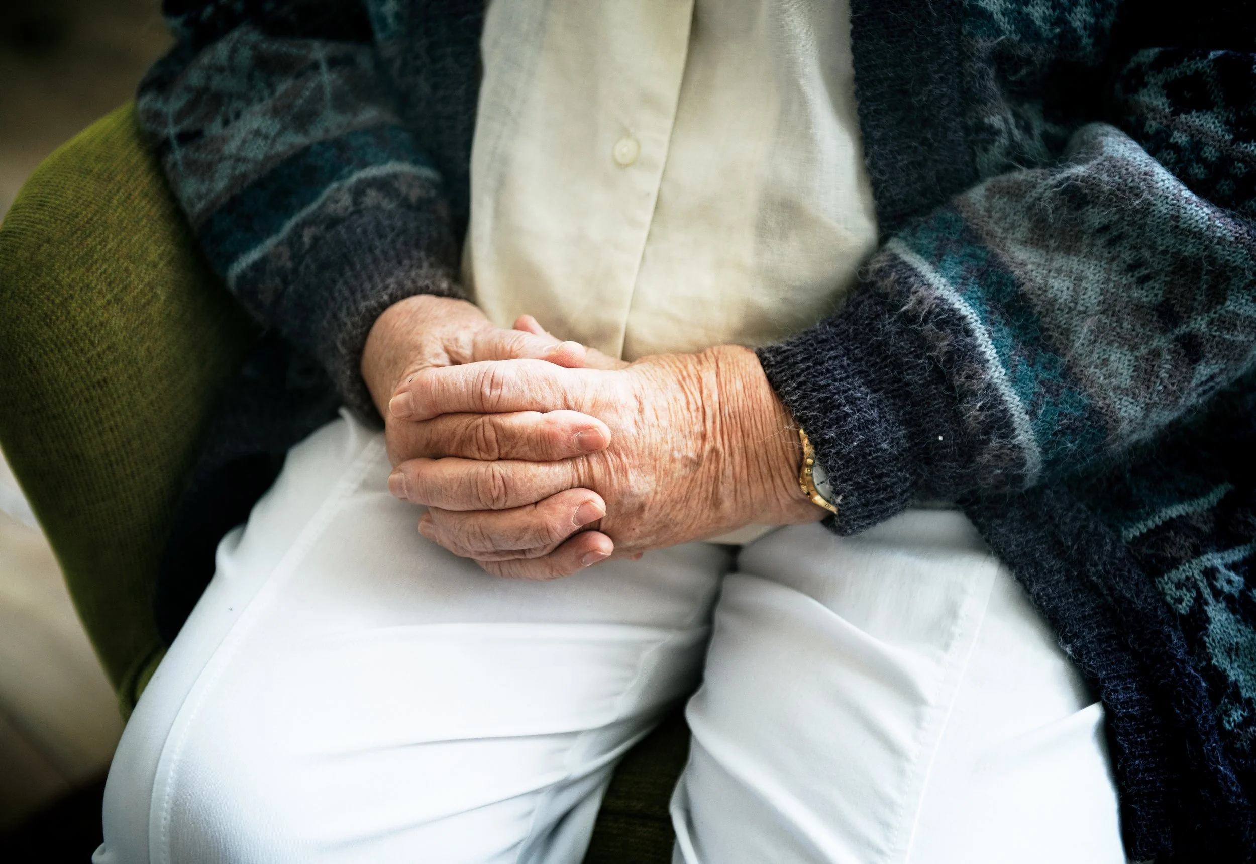 sitting-senior-man-close-up-his-holding-hands.jpg