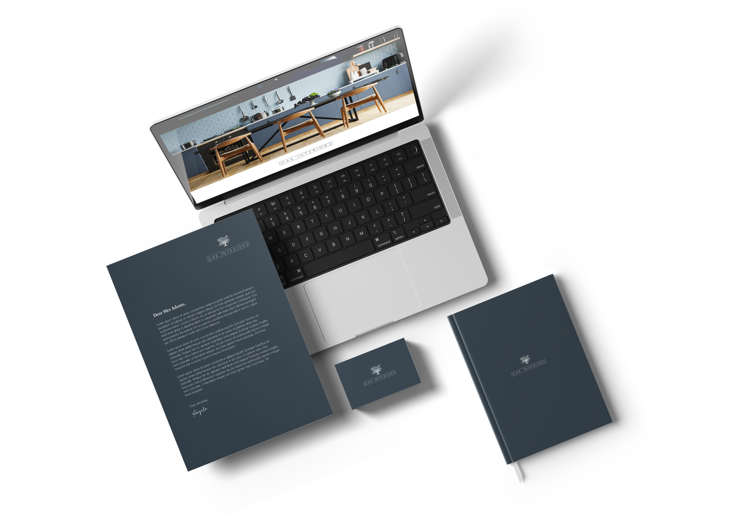 Laptop displaying a kitchen cabinet design, letter, business card, and notebook with branding for Oak Interior.
