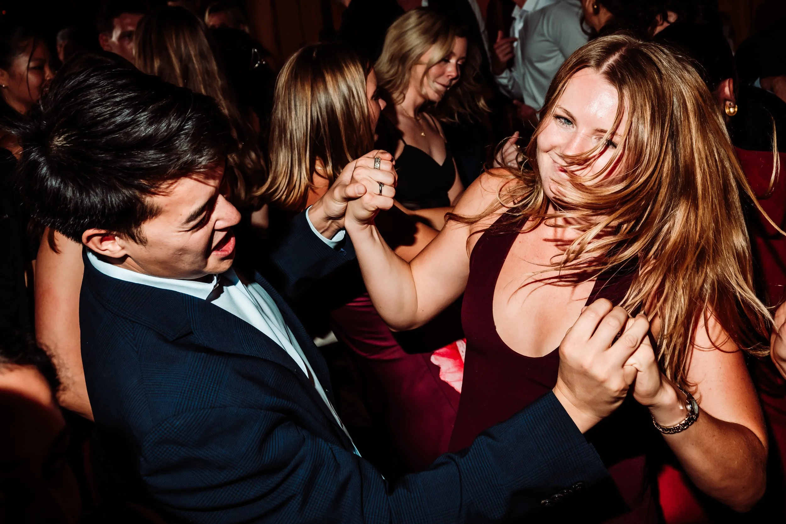 People dancing closely together at a party or social gathering.
