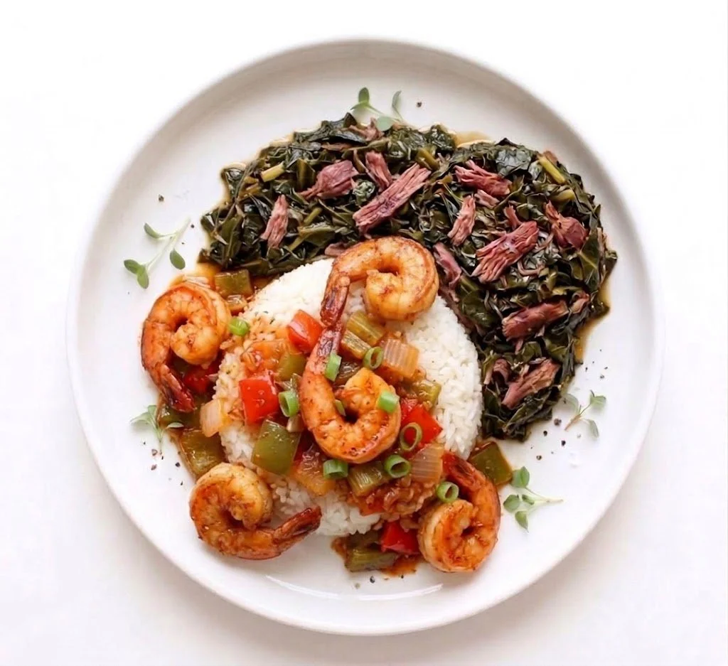 Shrimp with rice and sautéed vegetables served with cooked greens on a white plate.