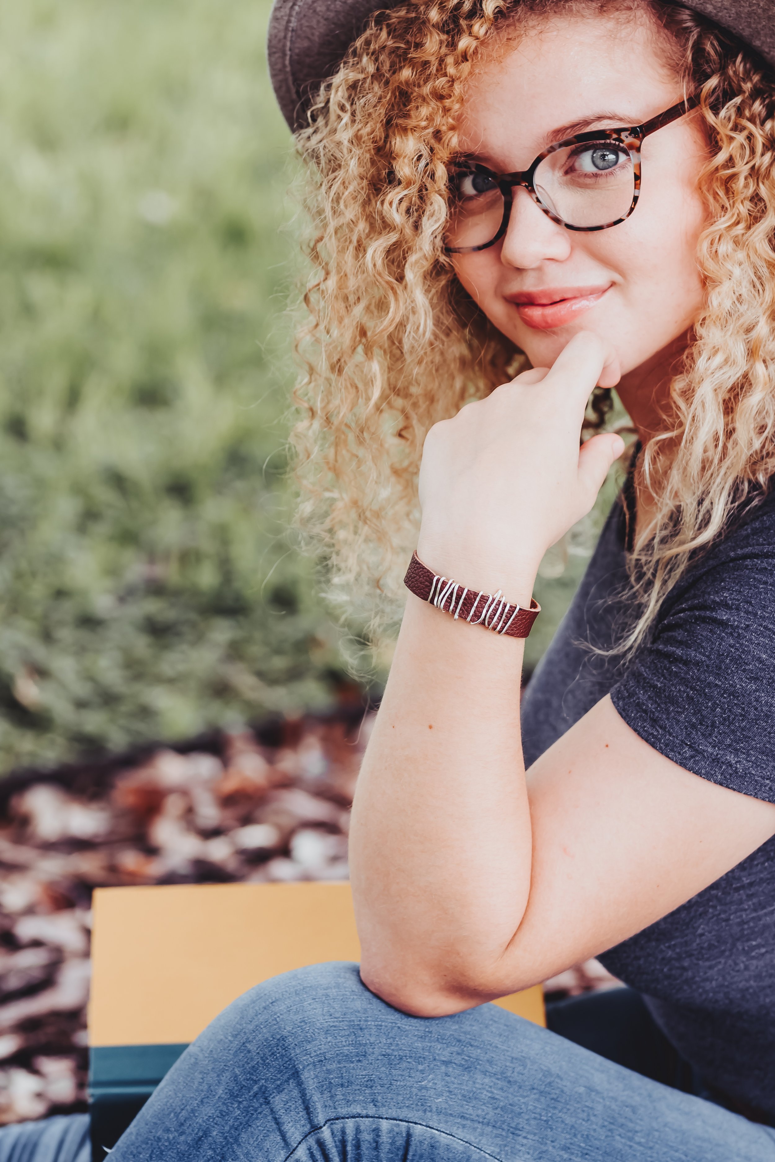 leather and wire wrapped bracelet on model lifestyle product photography