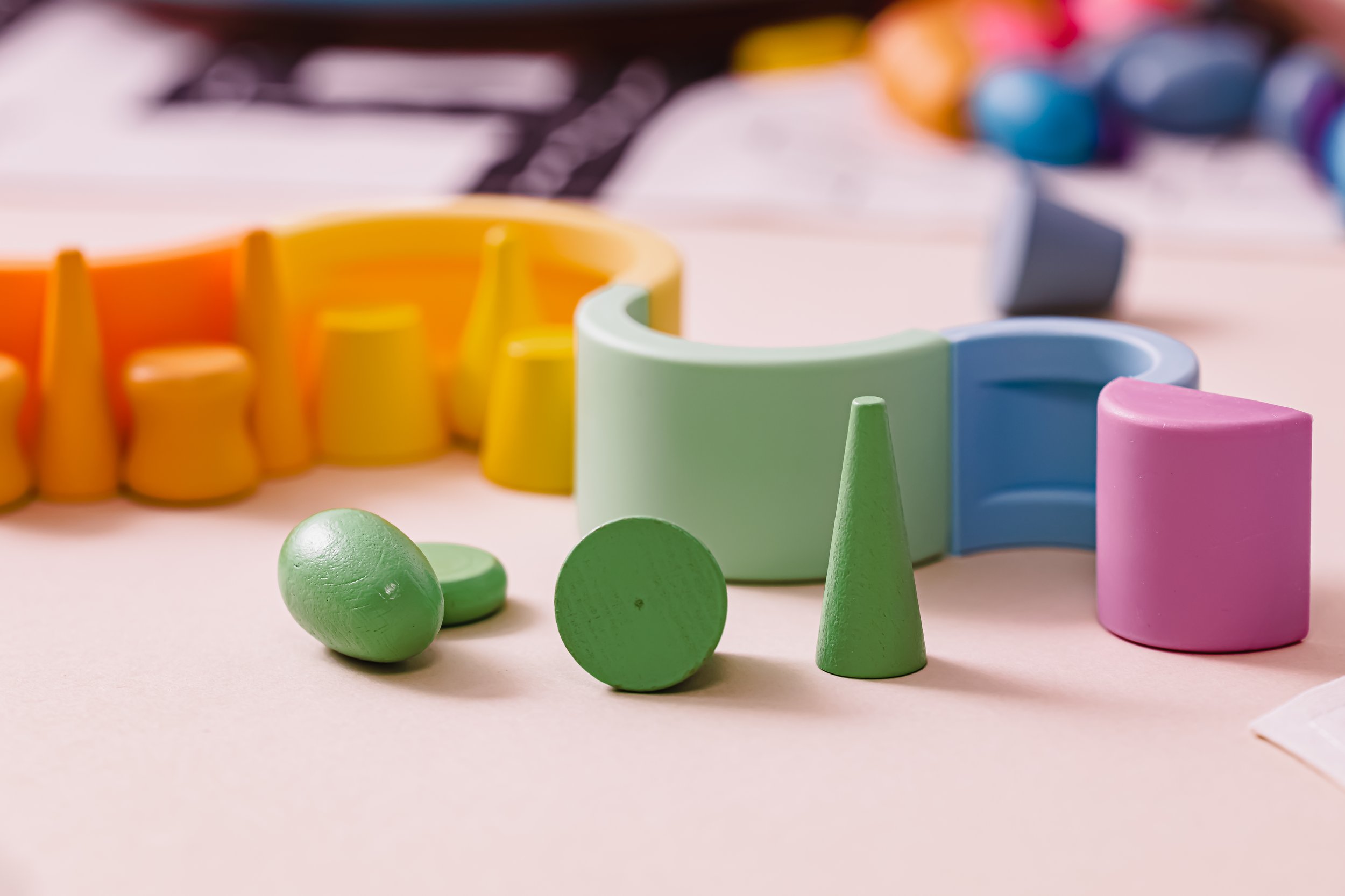 colorful wooden play puzzles blocks in different shapes and sizes