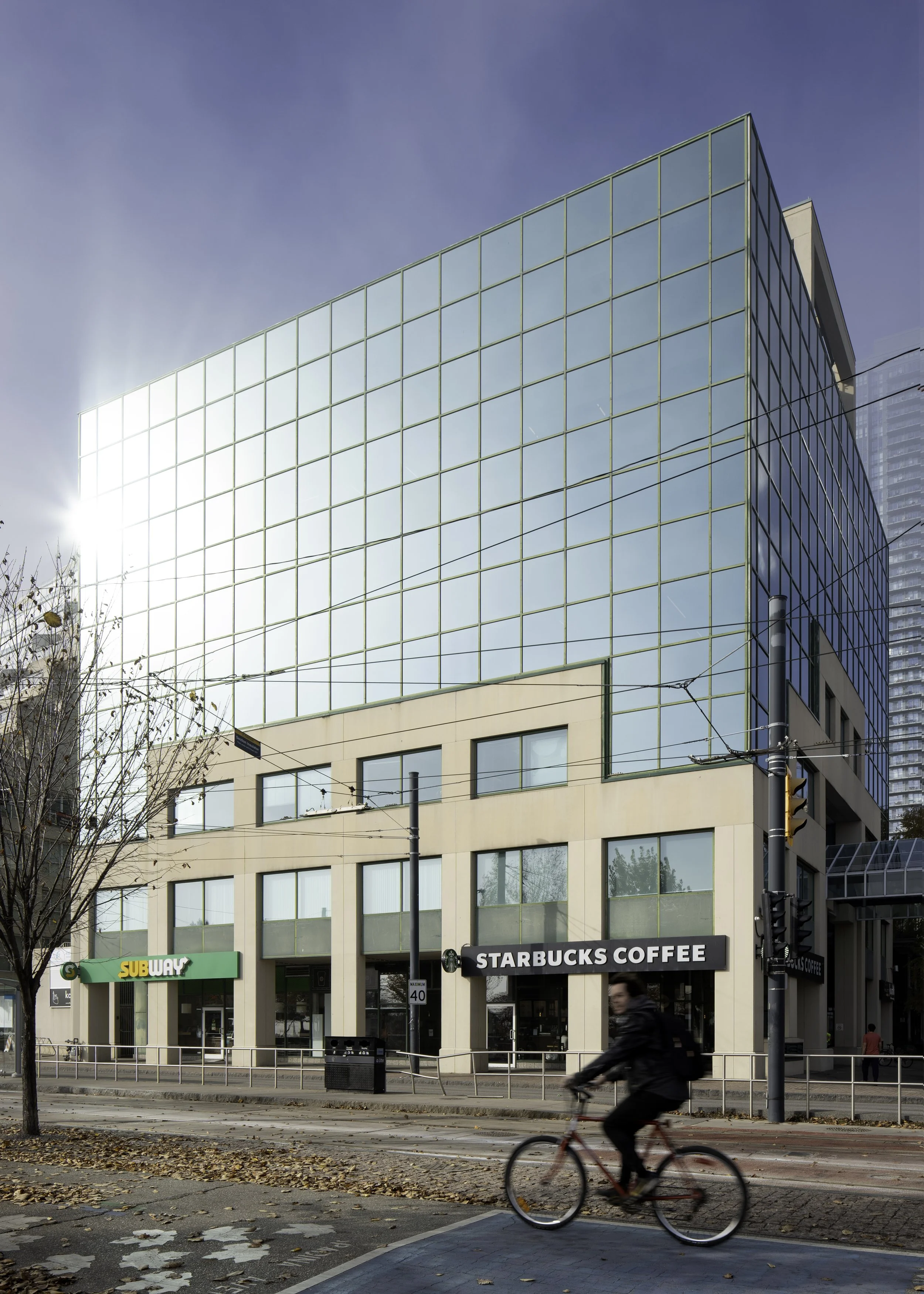Lakeshore building with cyclist.jpg