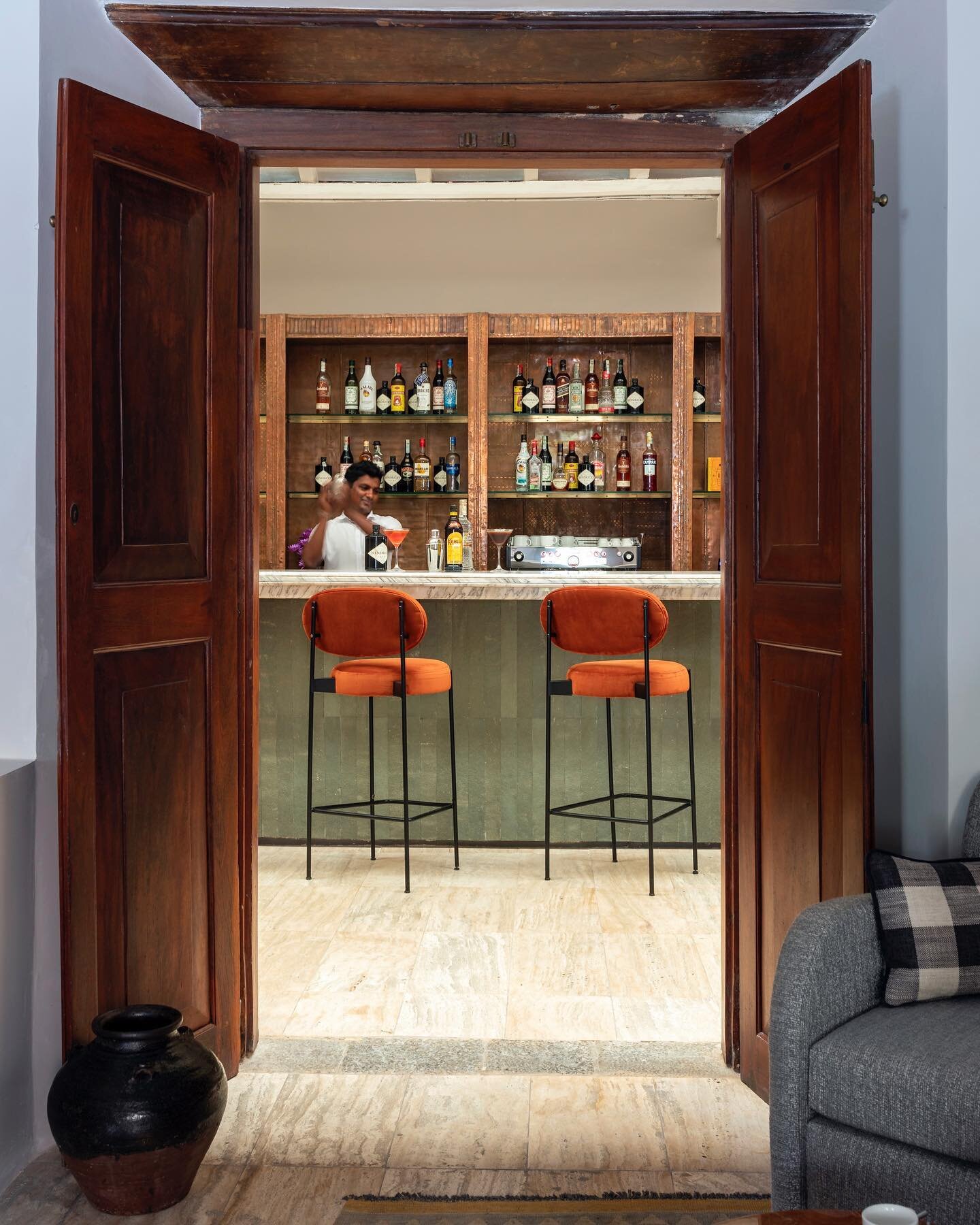 Sneak peak through these stunning traditional timber doors through to our copper and limestone cladded bar. Image courtesy @fwalkerarnottphotography