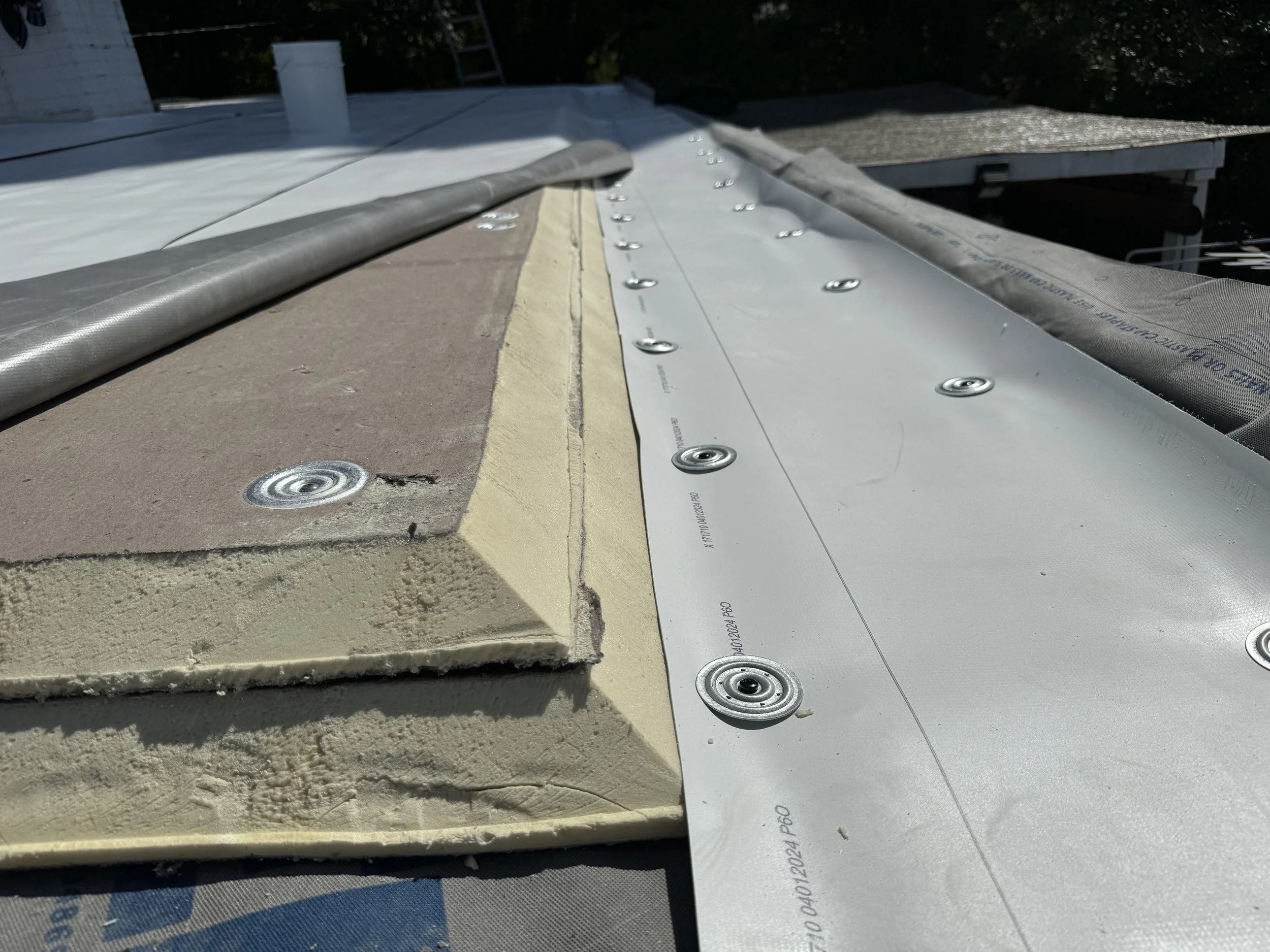This is a recover going over the existing roof with two layers of 2 inch insulation.   Using #3 screws and 2 1/4 inch barbed plates sounds like a solid choice for securing your materials. These components are crucial for ensuring the insulation and r