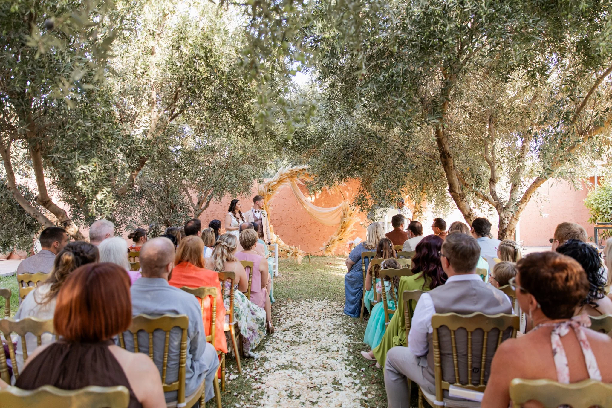 outdoor wedding reception under olive trees Morocco- marrakech wedding photographer
