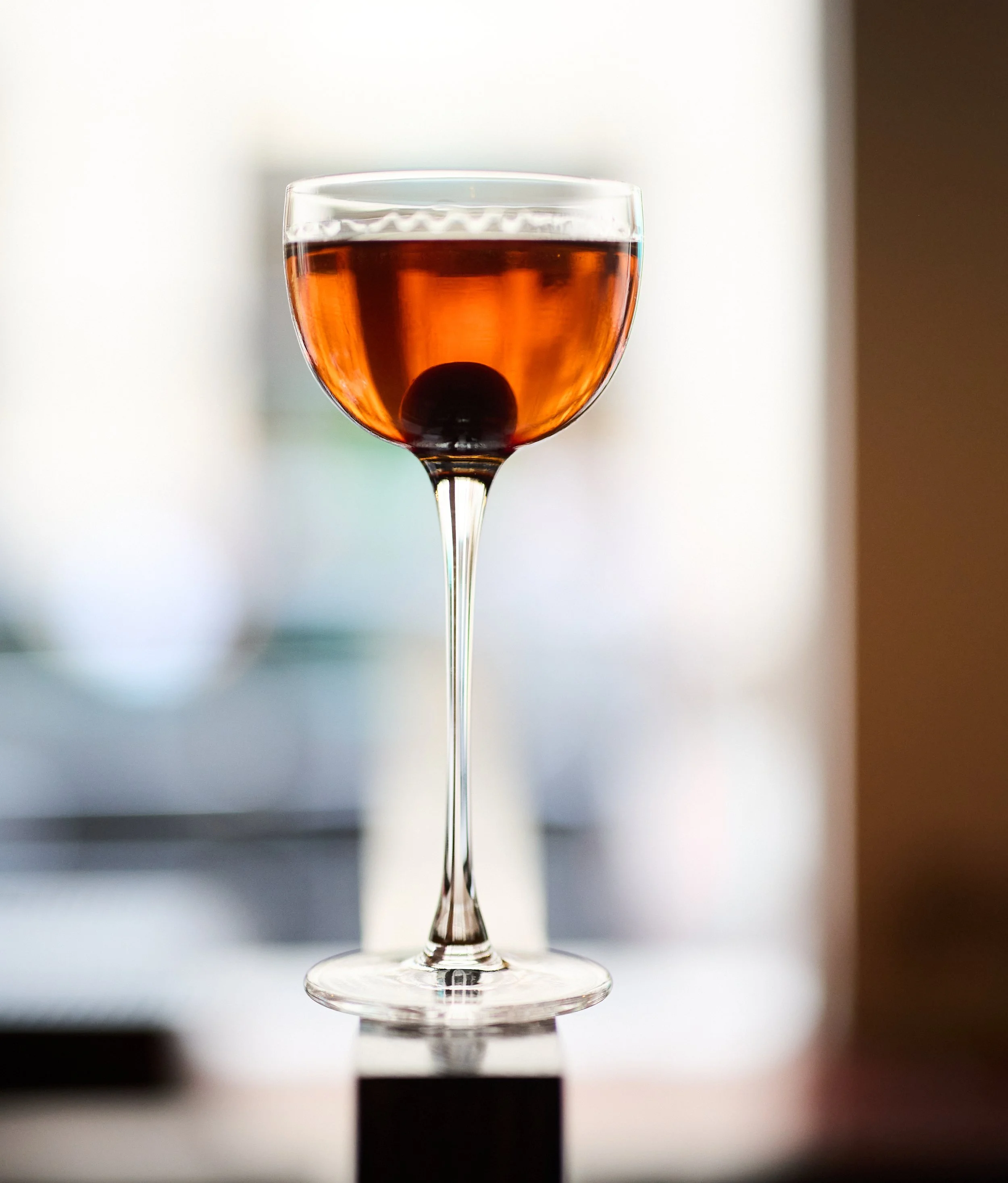 Old fashioned cocktail in glass with garnish from Goodman restaurant City