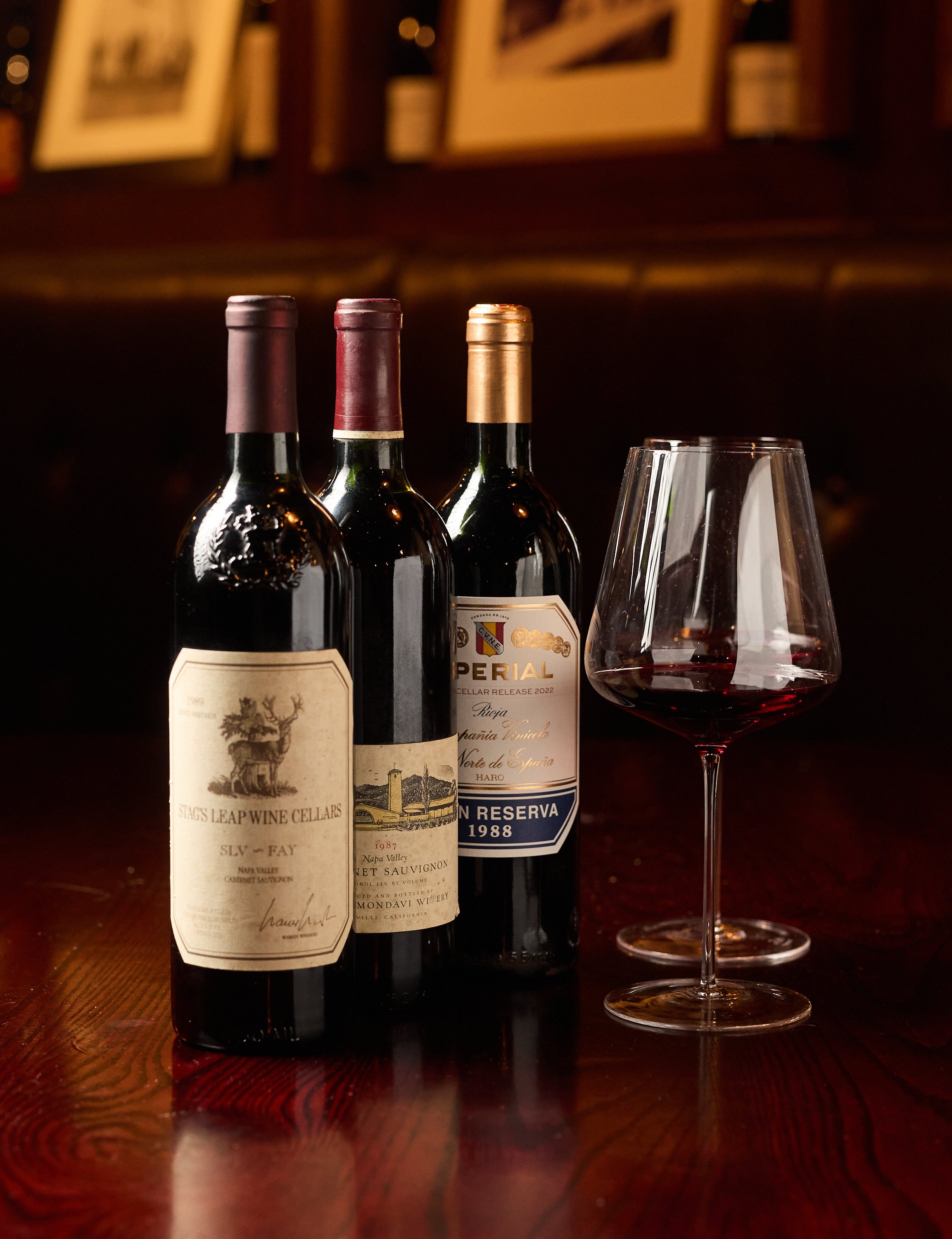 Red wine poured in two wine glasses on a table