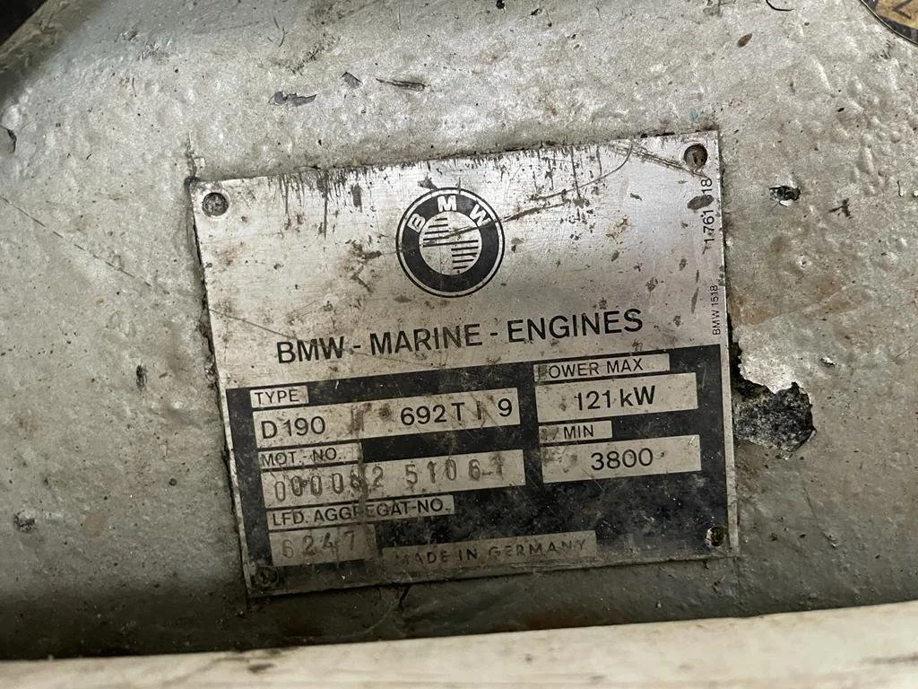 Metal identification plate on a BMW marine engine, showing specifications including type D190, power max 121 kW, and country of manufacture Germany.