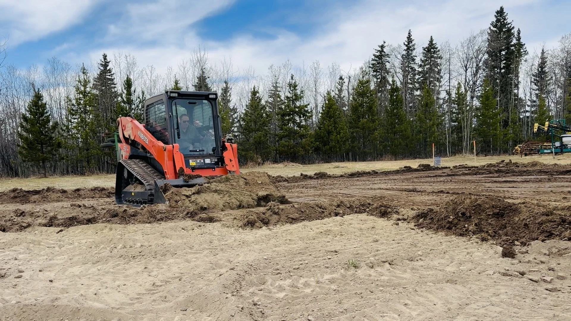 skidsteer on shop pad.jpg