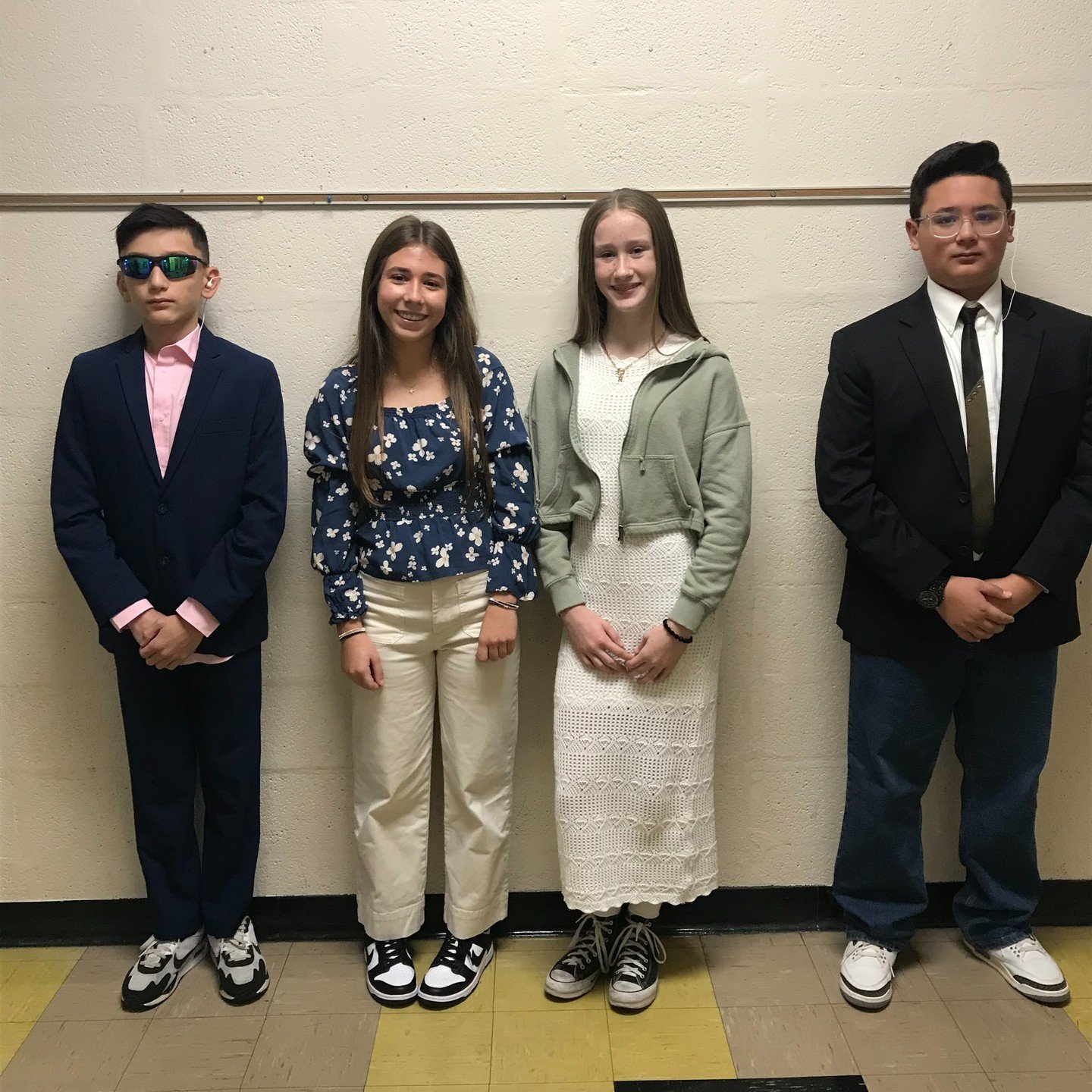 Dress to Impress: CCCS Student Government showing off their "Fancy Friday" outfits with student goverment president and vice president posing secret service escorts.