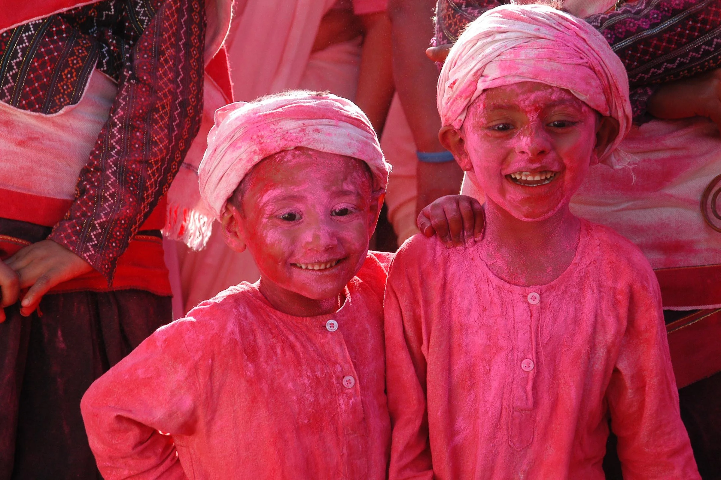 Film crew and extras celebrating Holi at Patan Durbar Square during Nippon Paint commercial shoot in Nepal