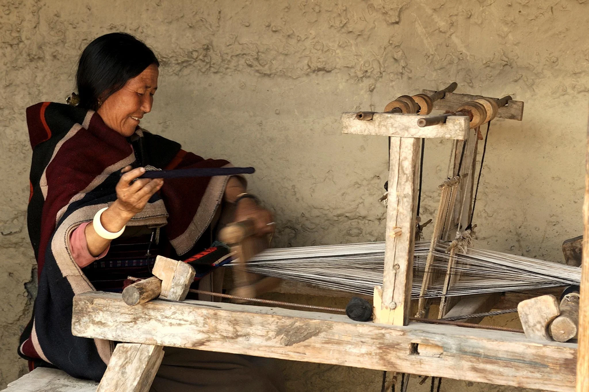 A woman from upper Dolpa in Nepal, a rural Himalayan region photographed in Mustang, Nepal. Award winning cultural heritage photographer Gautam Dhimal does a lot of ngo documentary photography in extreme rural Nepal.