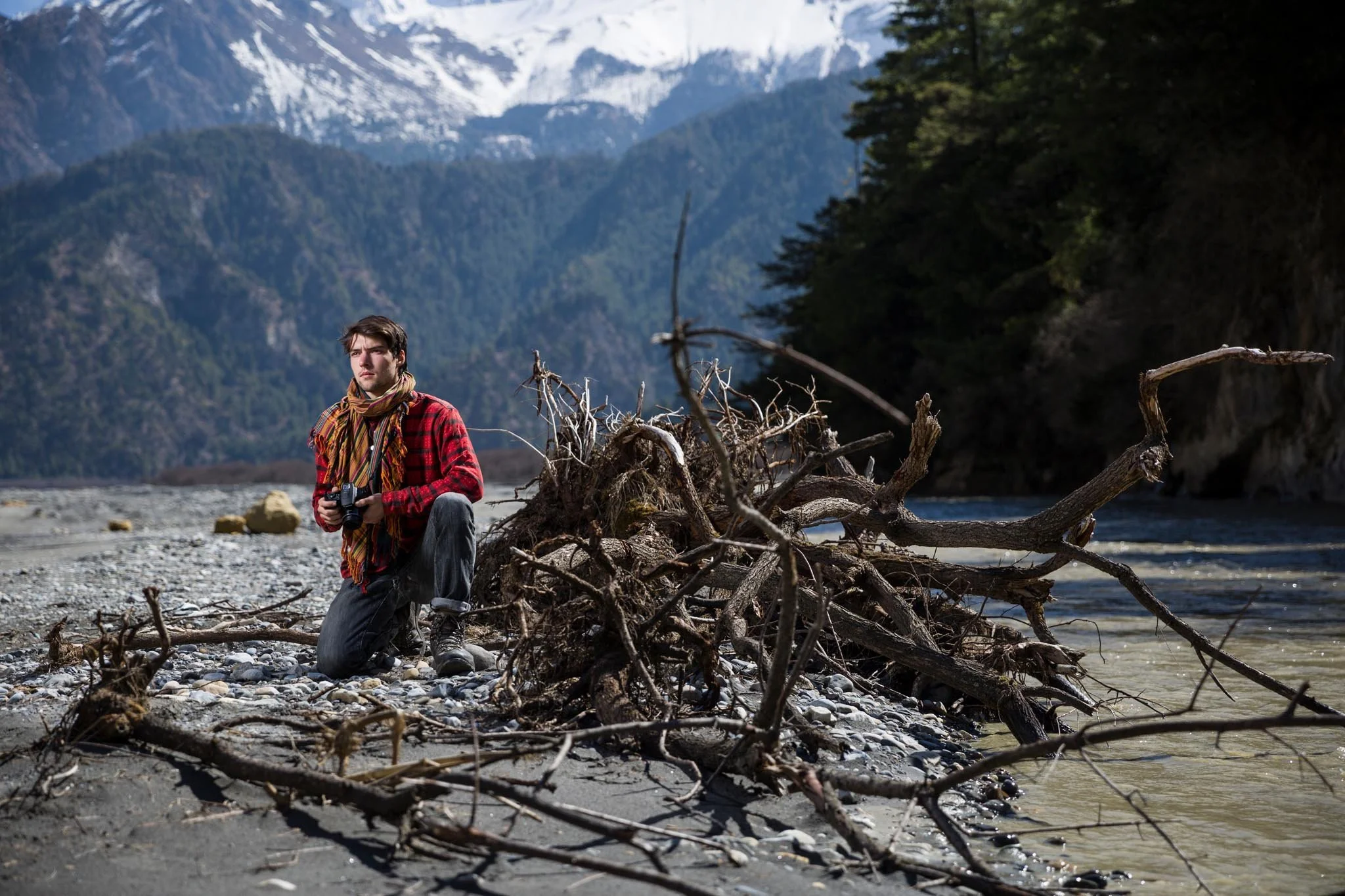 Adventurer Kealan Thor Knox standing against a Himalayan backdrop during a portrait session by Gautam Dhimal