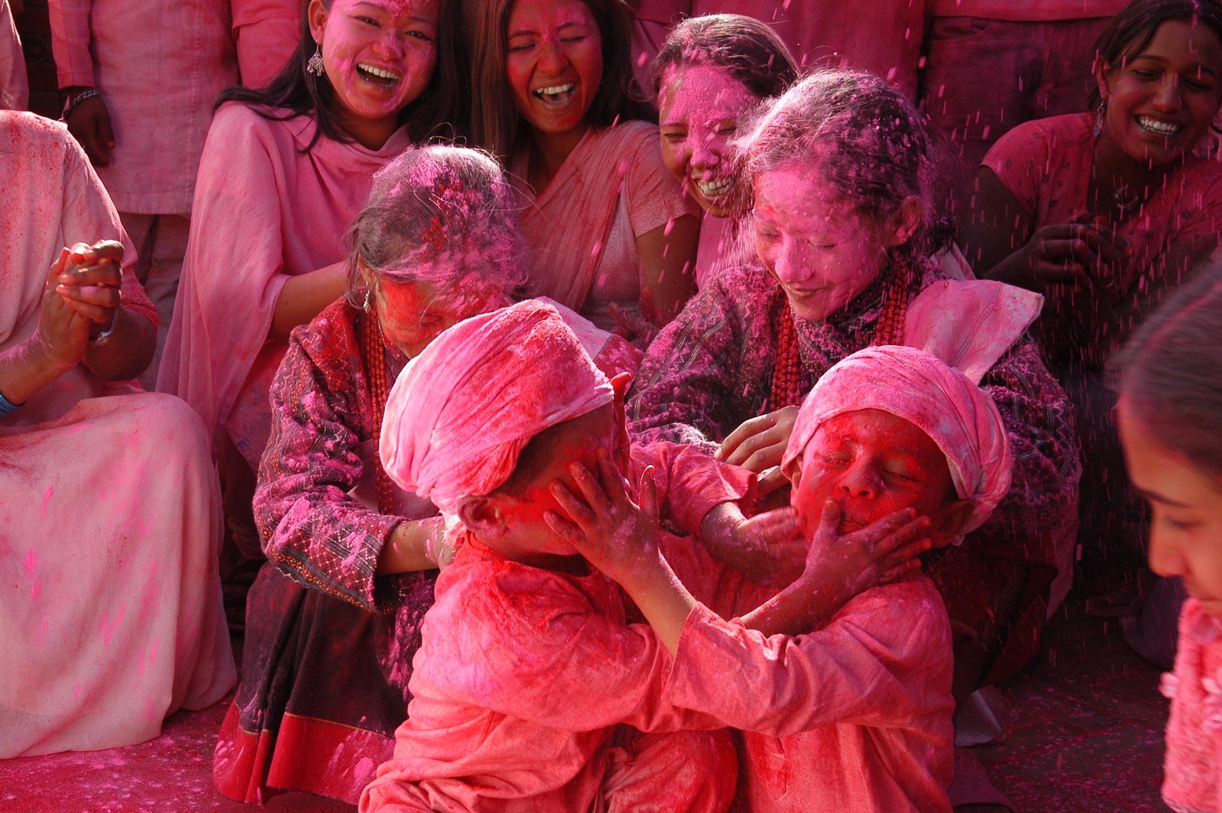 Film crew and extras celebrating Holi at Patan Durbar Square during Nippon Paint commercial shoot in Nepal
