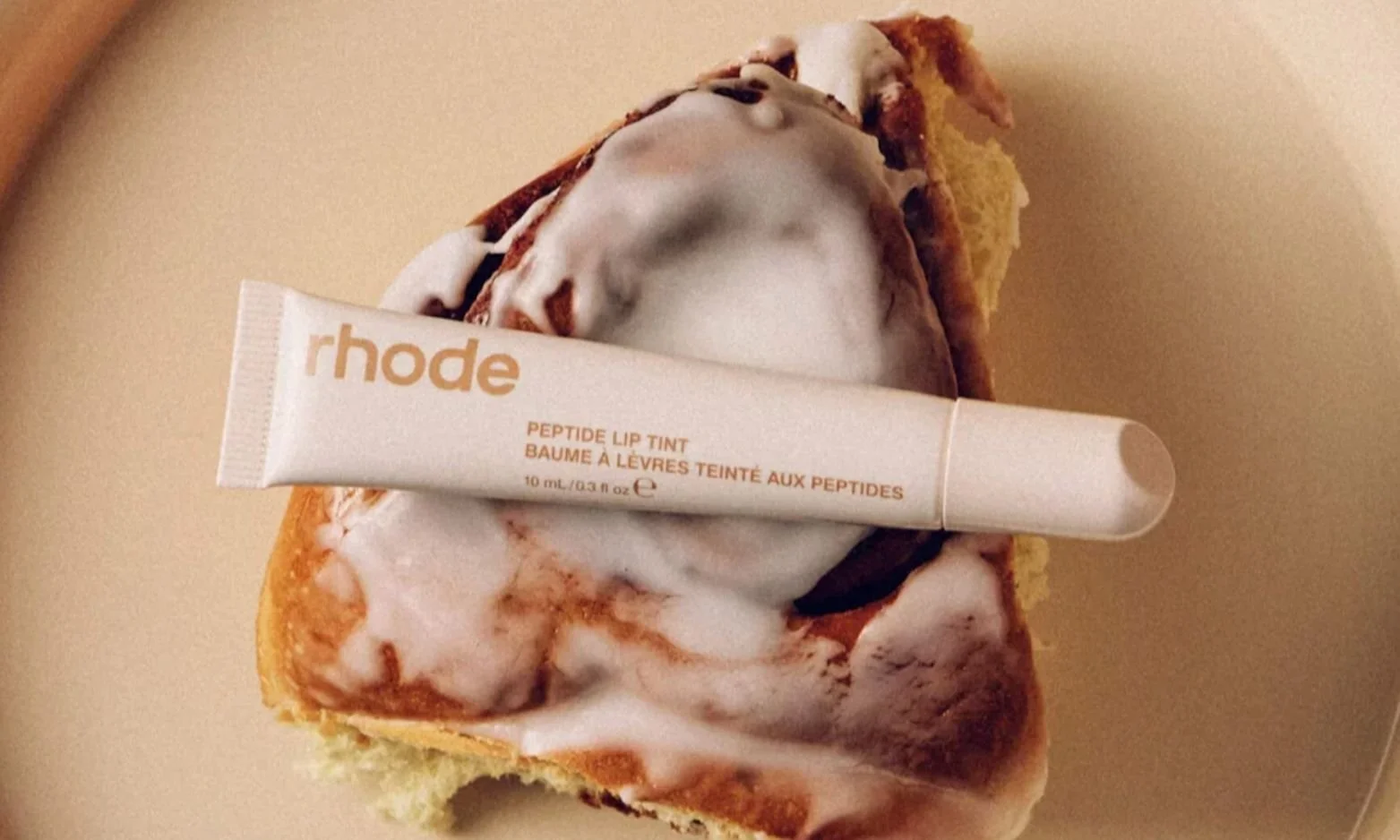 A cinnamon bun with Rhode lip tint on top of it is a great example of sensory marketing.