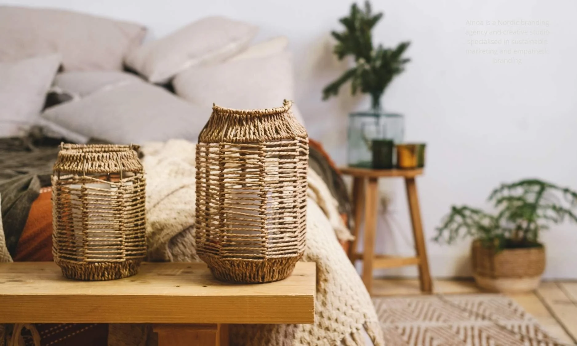 Nordic-style minimalist interior with natural wood, soft textiles, and muted green tones, illustrating the common aesthetic associated with Nordic branding.