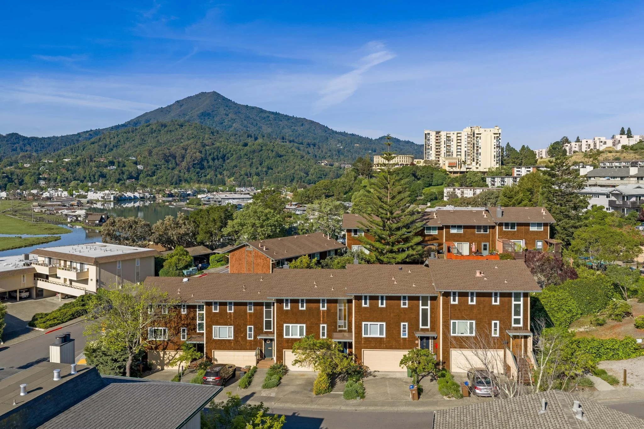 brown-shingled townhouses with Mt. Tam in the background