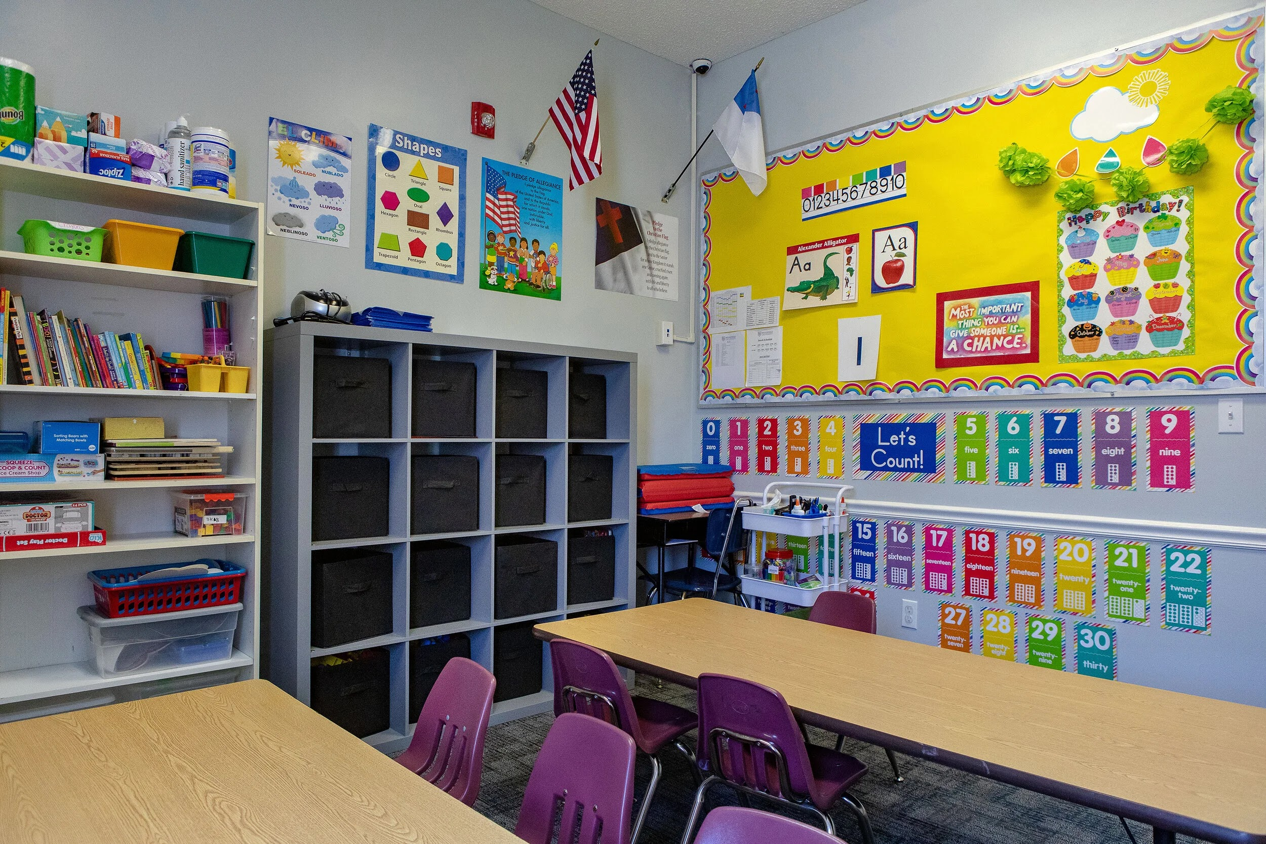 Classroom at Wedgefield University for Kids with student tables, educational materials, books, and colorful learning displays.