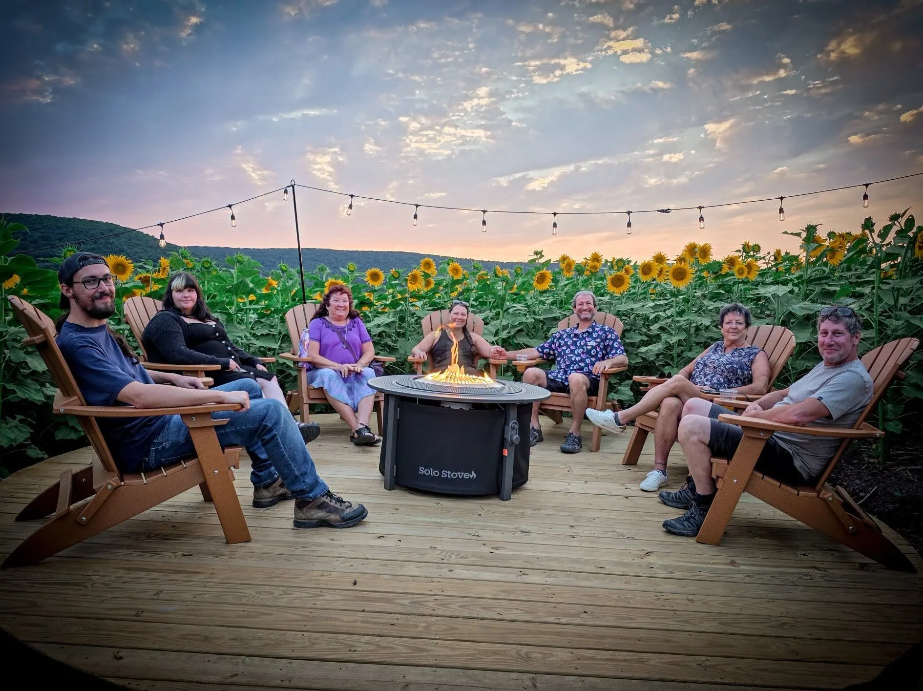 Fire pit surrounded by sunflowers at Heisler's Creamery