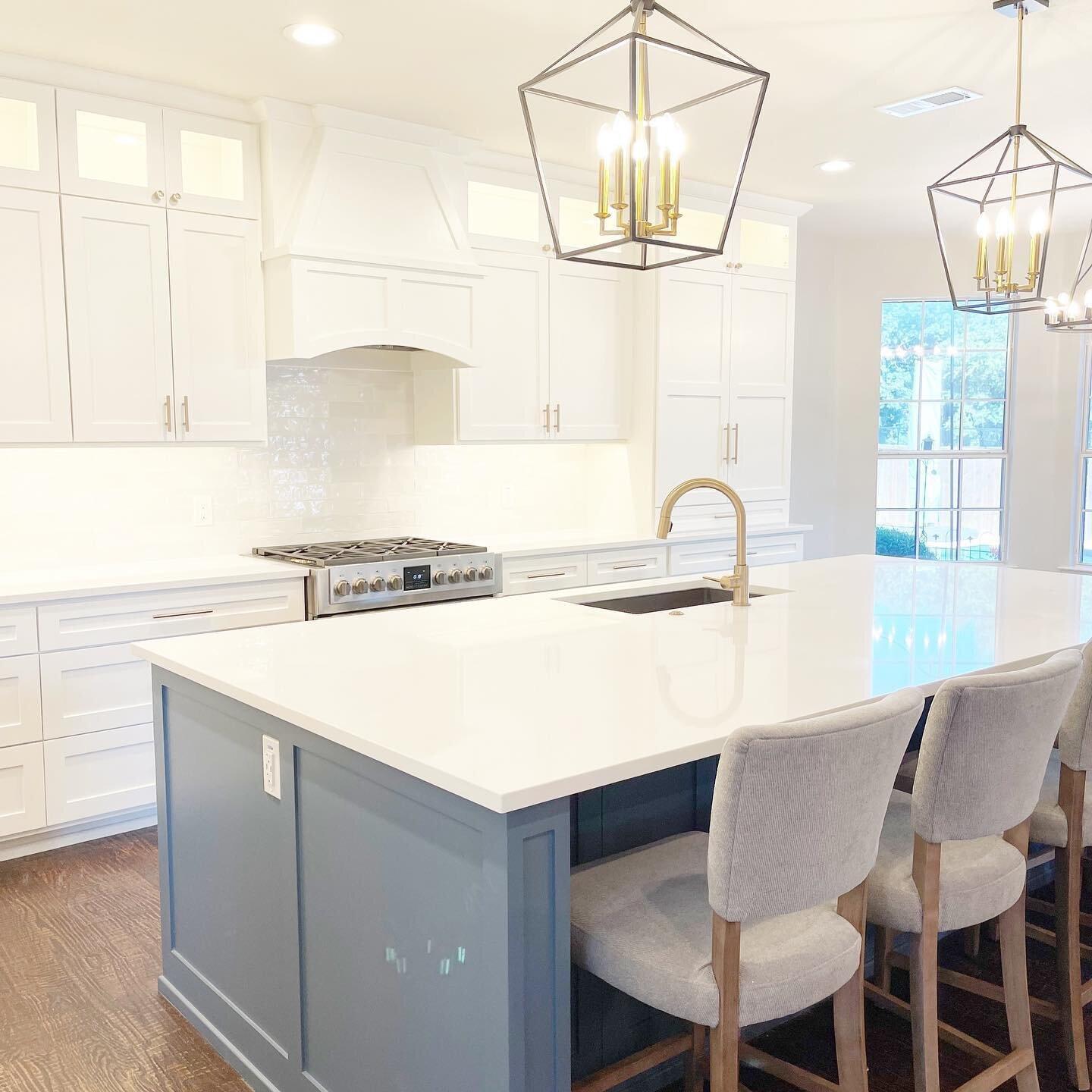 The goal in this kitchen remodel was to add space and function. We removed the side pantry and created more counter space as well as built-in custom pantries that fit seamlessly with the design of the kitchen. We also removed columns to open up the k