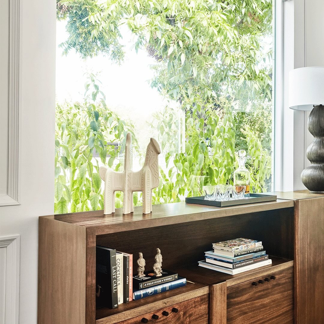 Spaces should be maximized for multiple functions, and this room does just that. We created this long credenza to display, store, and entertain while pulling the room together. 

Photography @michaelwiltbank 
Interior and Styling @yatesdesygn 
Custom