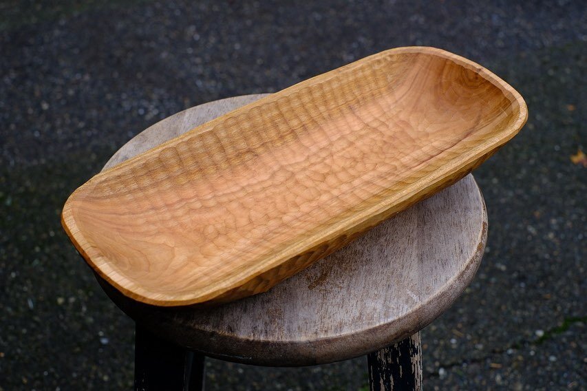A recently completed piece from cherry wood. This is a long symmetrical flat top trough style bowl. I intentionally made the interior more shallow than my previous work. It was actually rather difficult at first not to go as deep as I was used to. Th